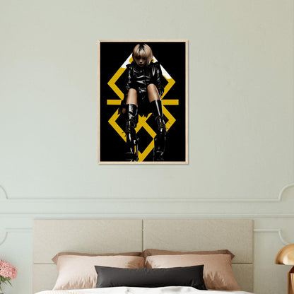 Framed poster of a person in black clothing posing against a geometric yellow background.