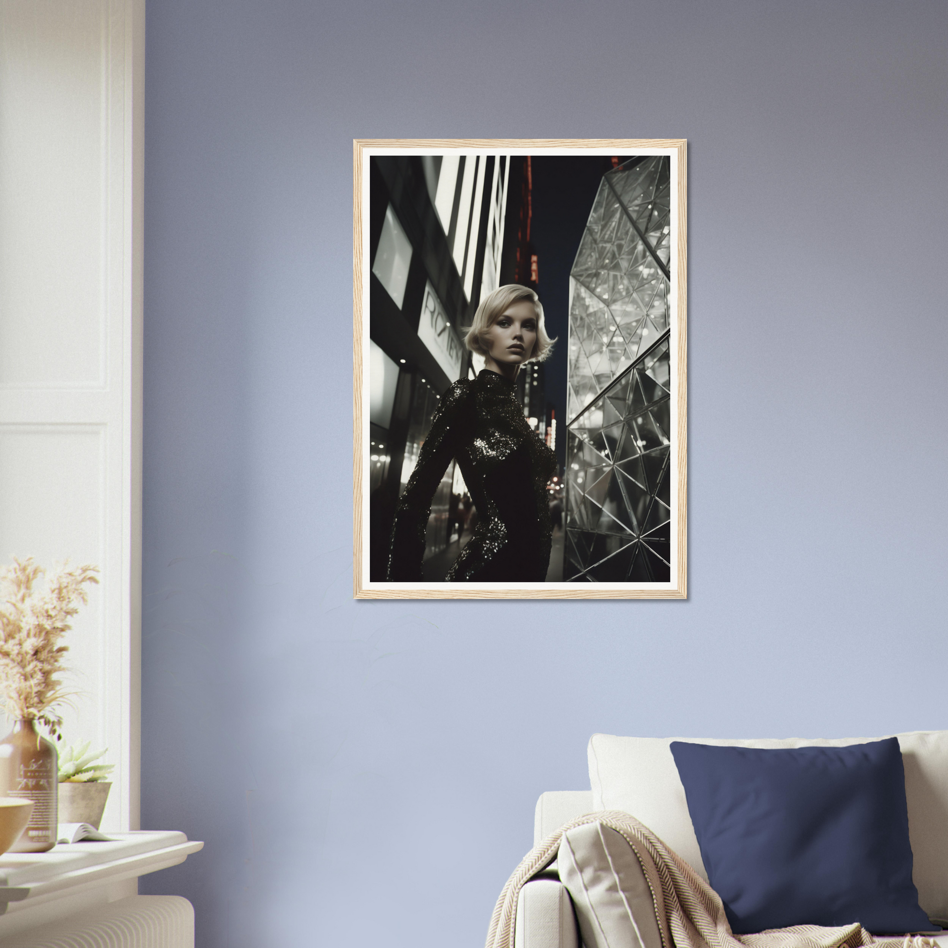 Framed black and white photograph of a person in an urban setting with dramatic shadows and architectural elements.