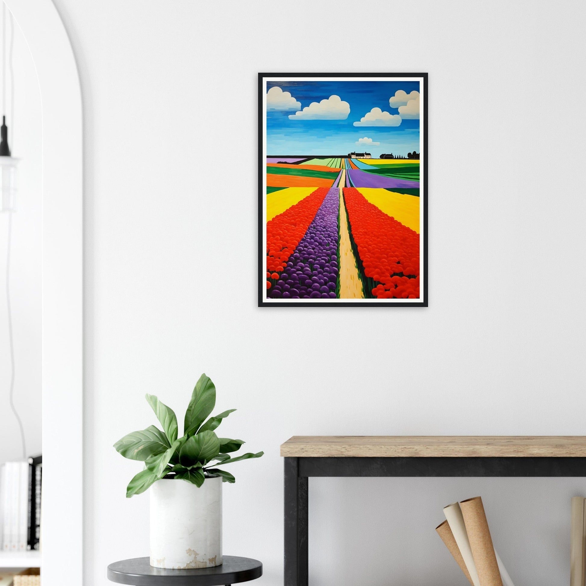 Colorful framed painting of vibrant flower fields stretching towards the horizon under a blue sky with white clouds.