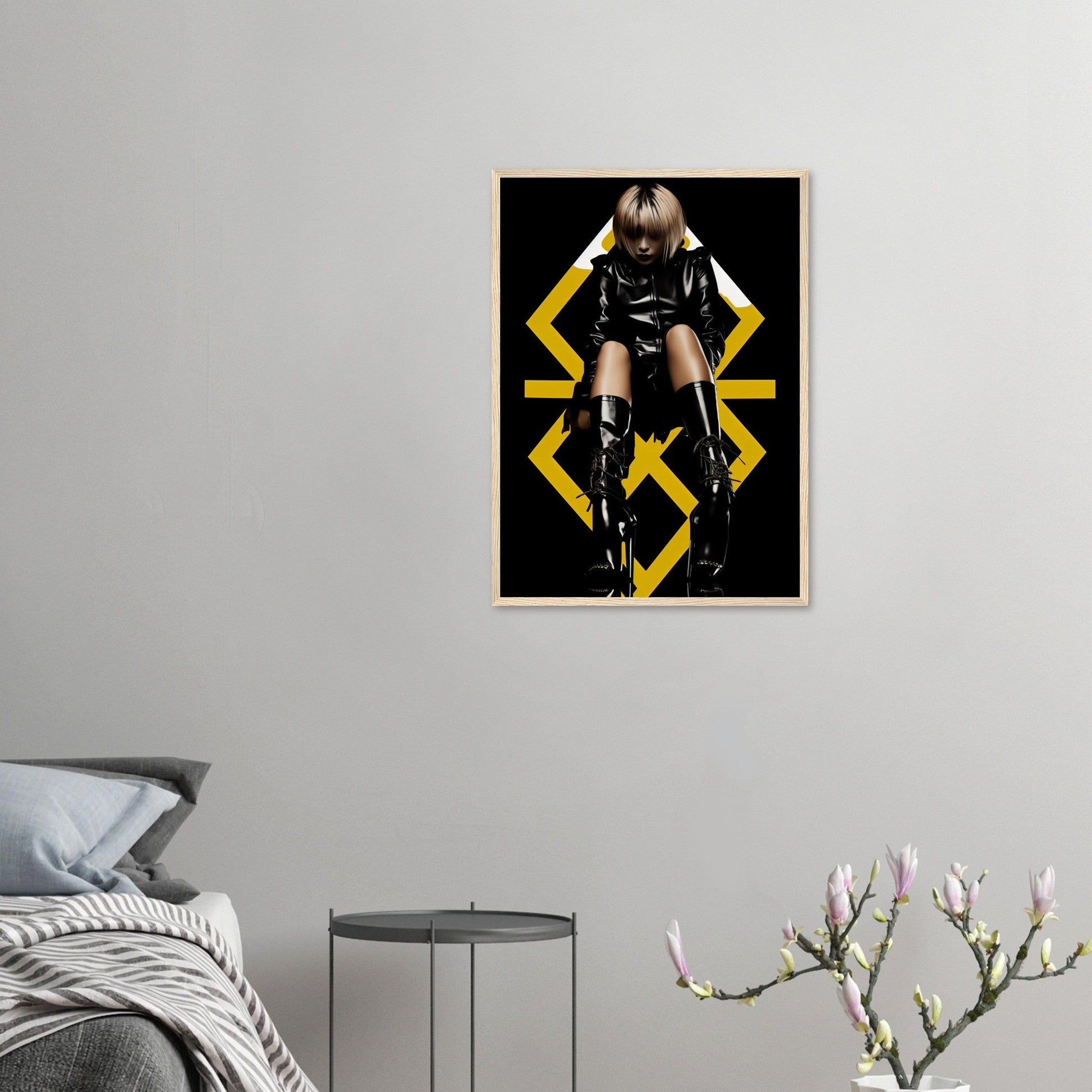 Framed poster featuring a person in black clothing posing dramatically against yellow geometric shapes.