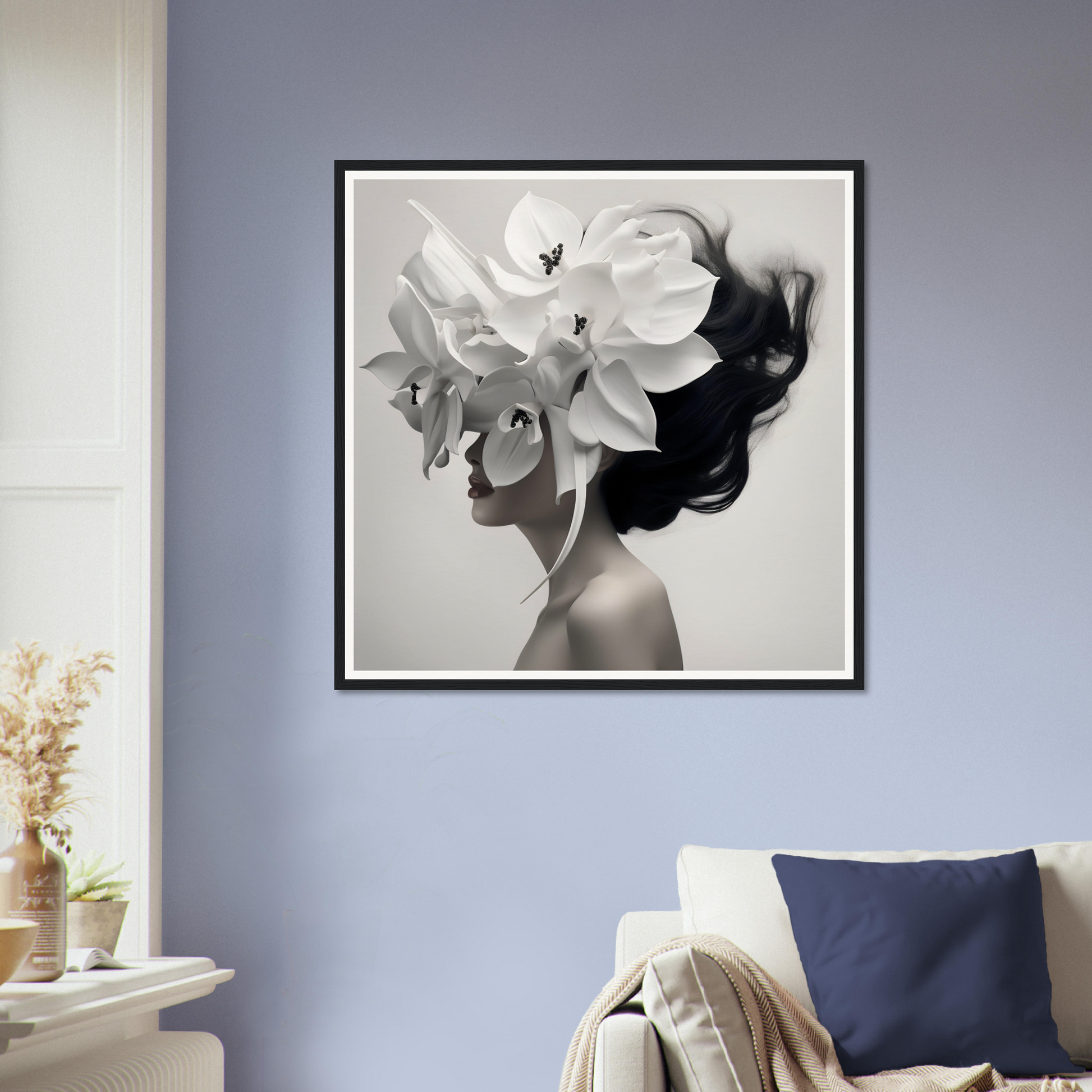 Framed black and white artwork depicting a silhouette with floral elements.