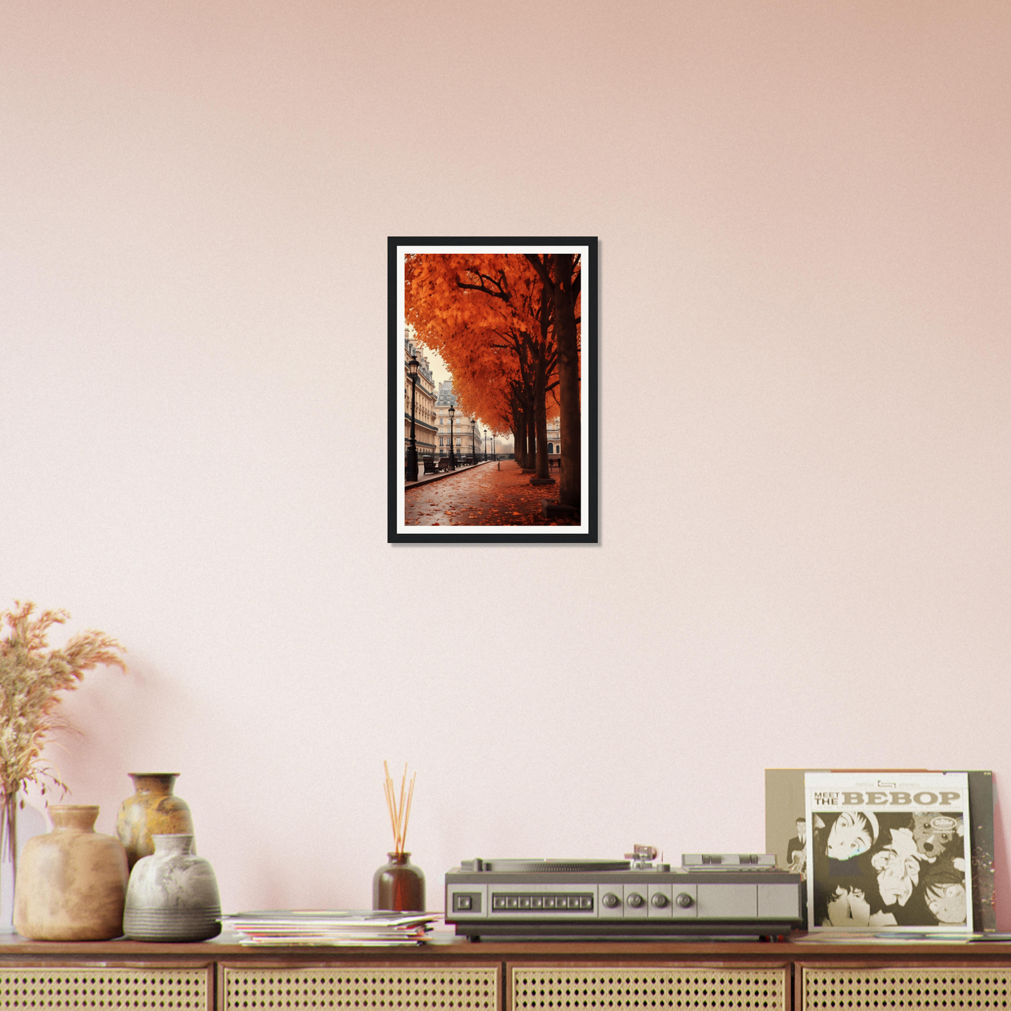 A framed photo of a tree lined with orange leaves