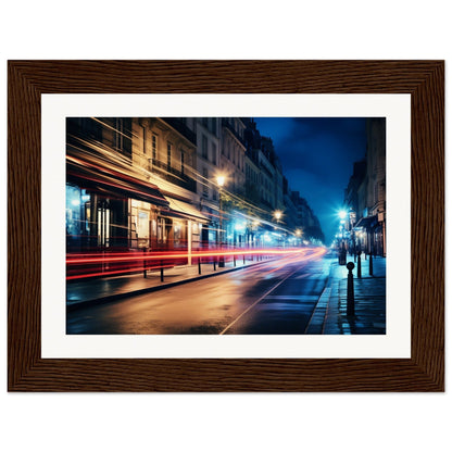 A framed photograph of a city street at night