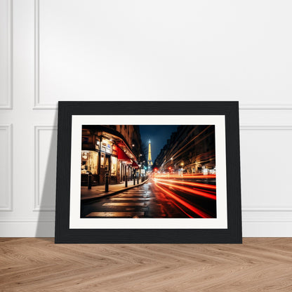 A framed photograph of a city street at night