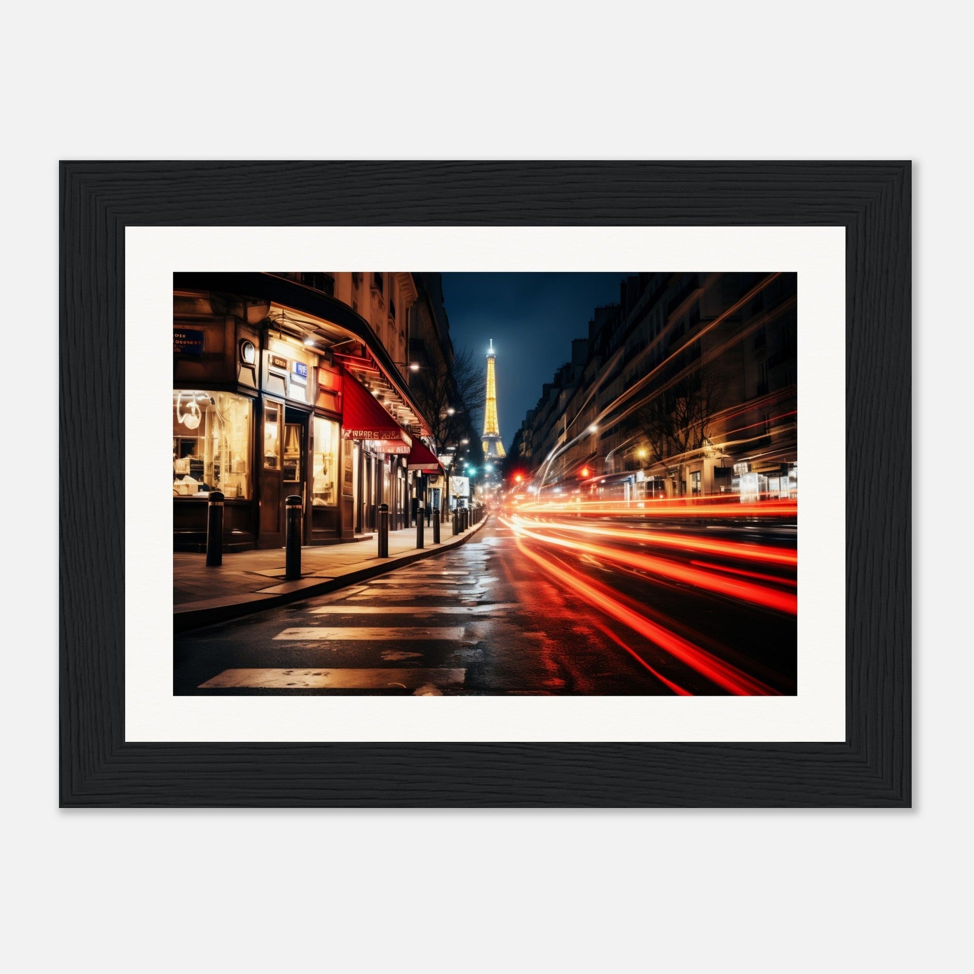 A framed photograph of a city street at night