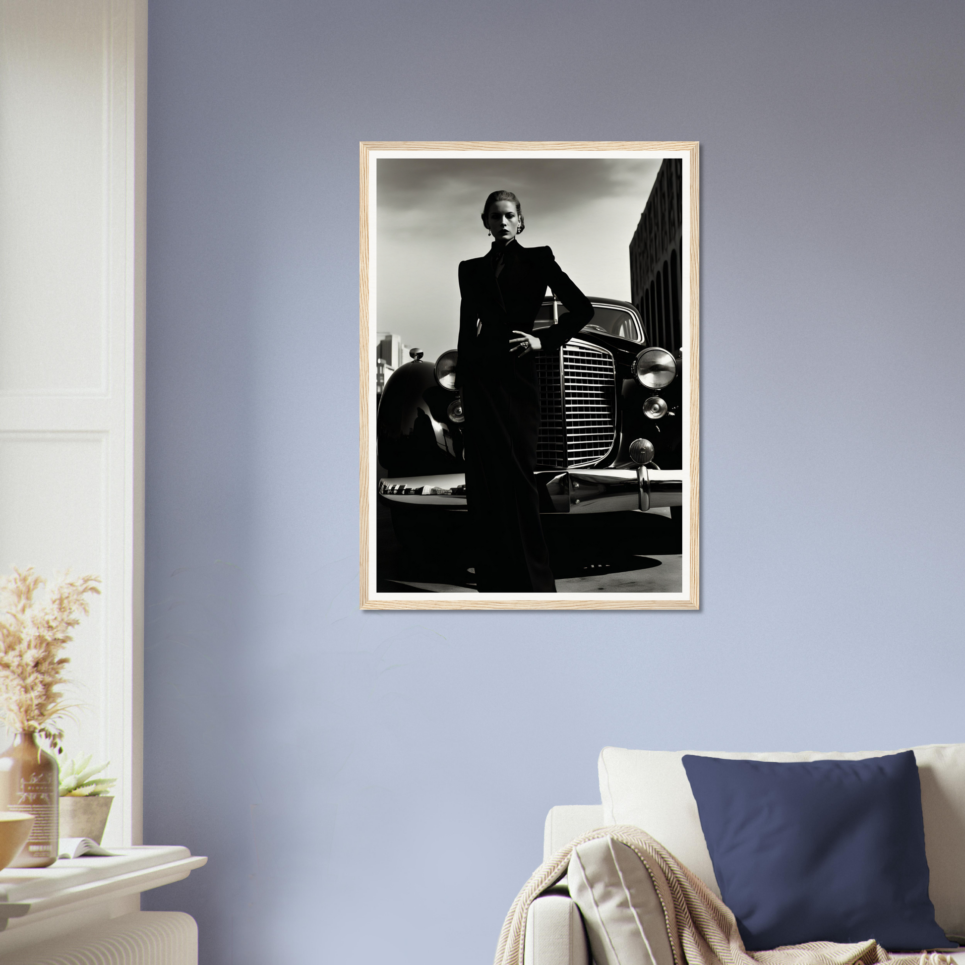 A framed photograph of a man leaning on a car