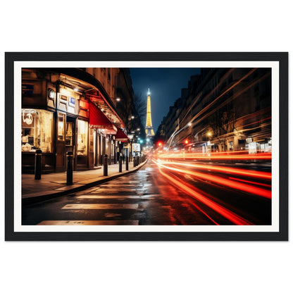 A framed photograph of a street in london at night