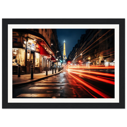 A framed photograph of a street at night