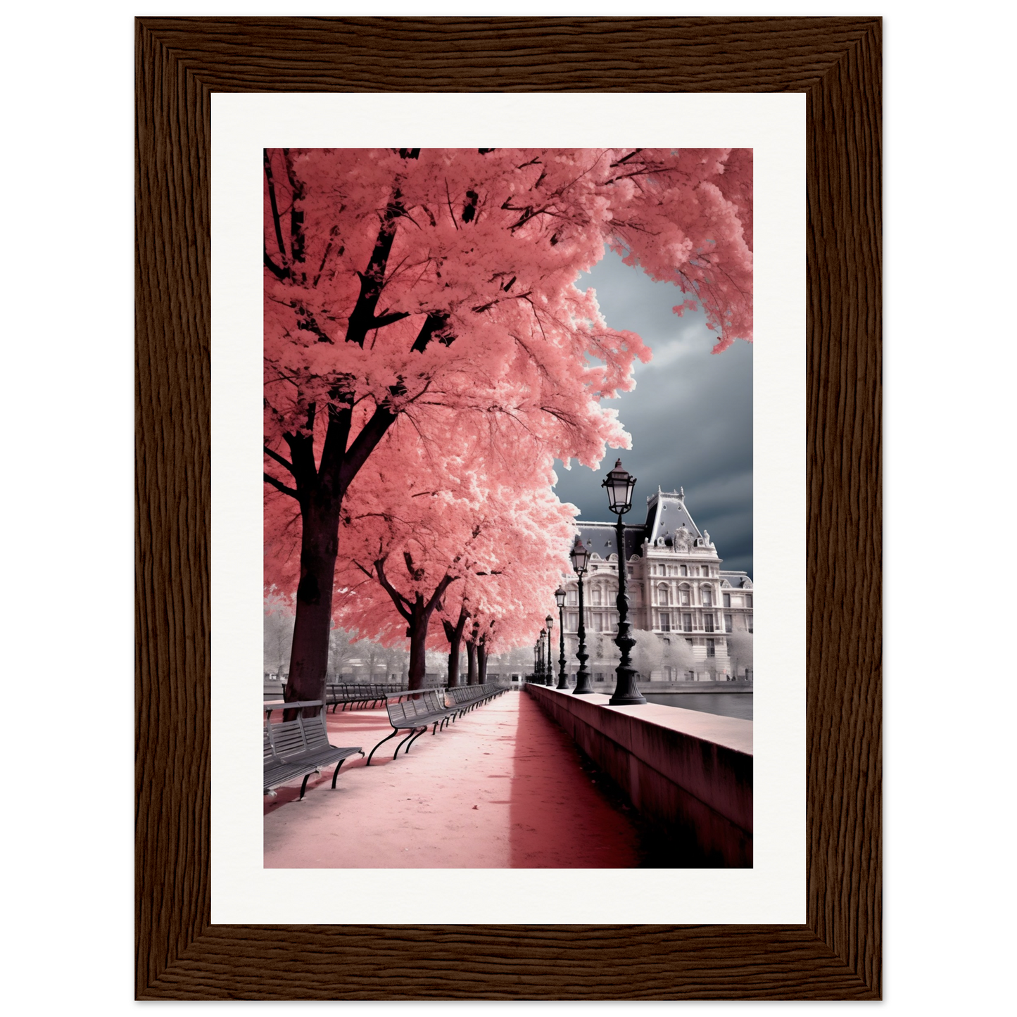 A framed photograph of a tree with pink leaves