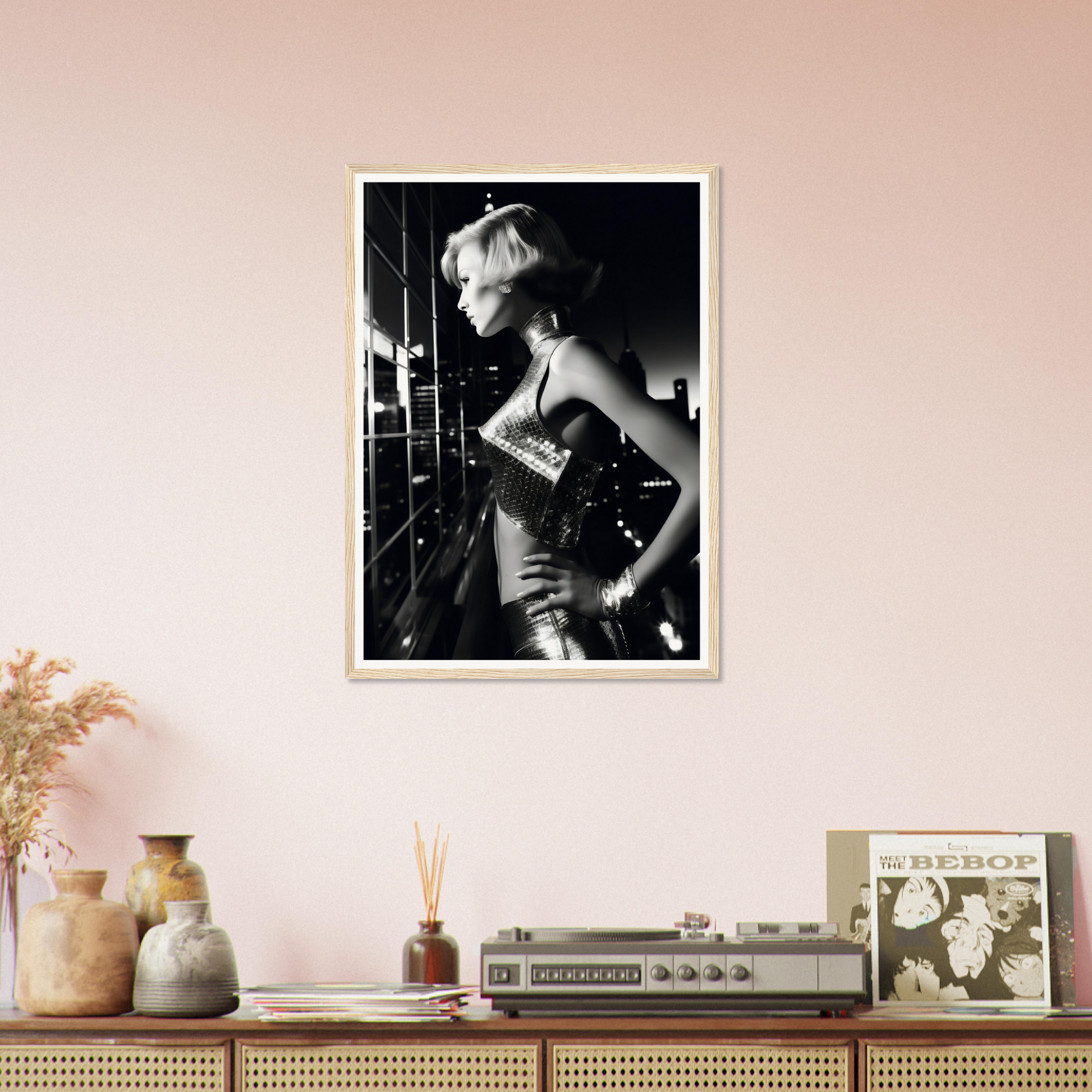 A framed photograph of a woman in a black dress