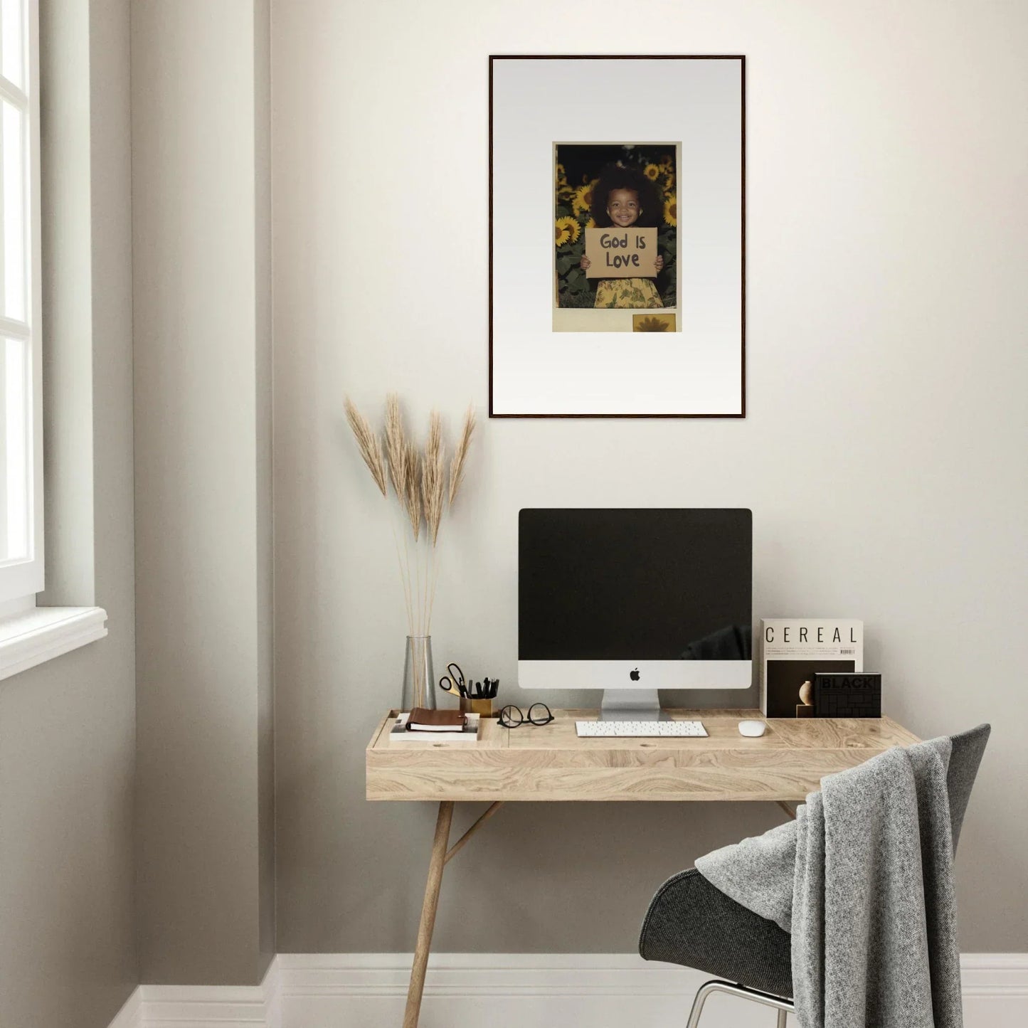 Minimalist home office with wooden desk, computer, and stylish wall art for room decoration