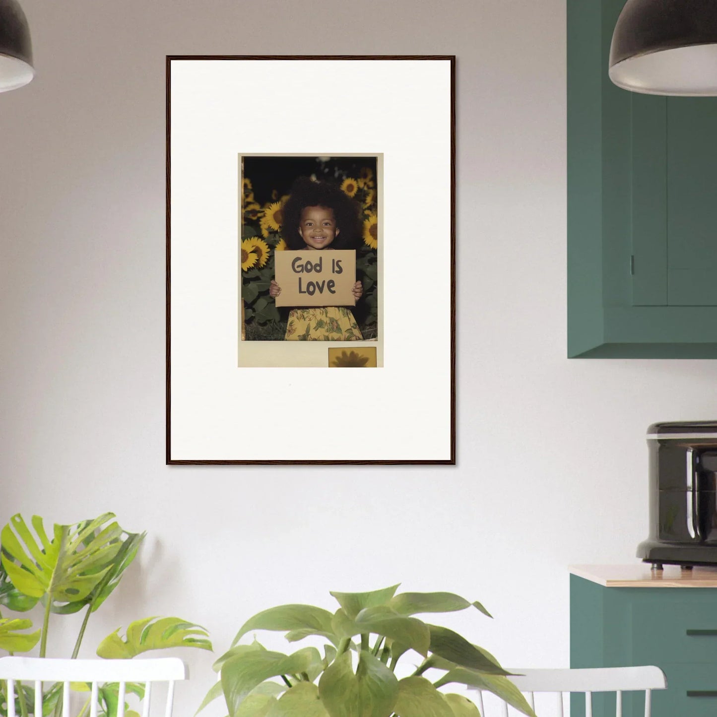 Framed wall art of a child with a God is Love sign amidst sunflowers for room decoration