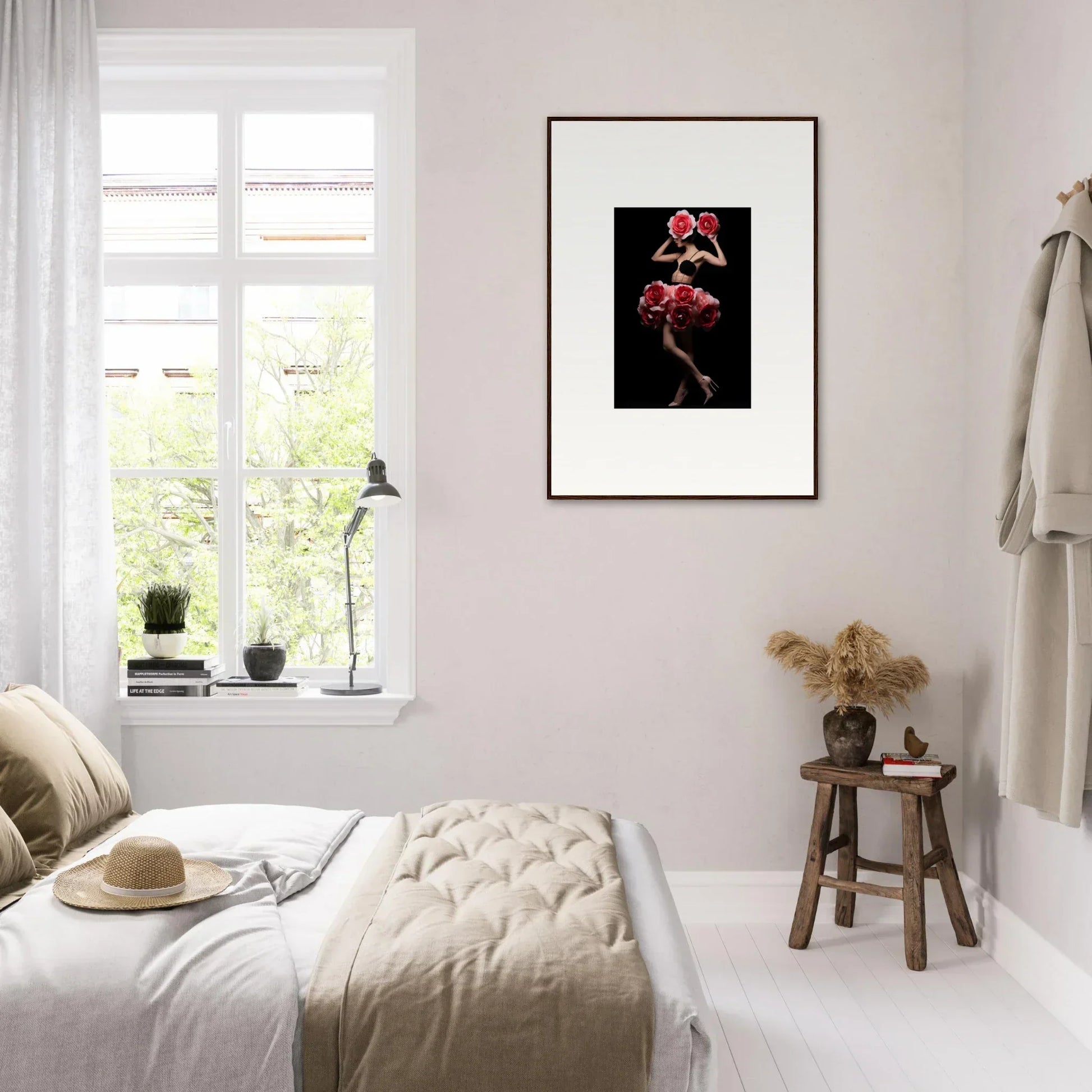 Framed artwork of red flowers against a black background.