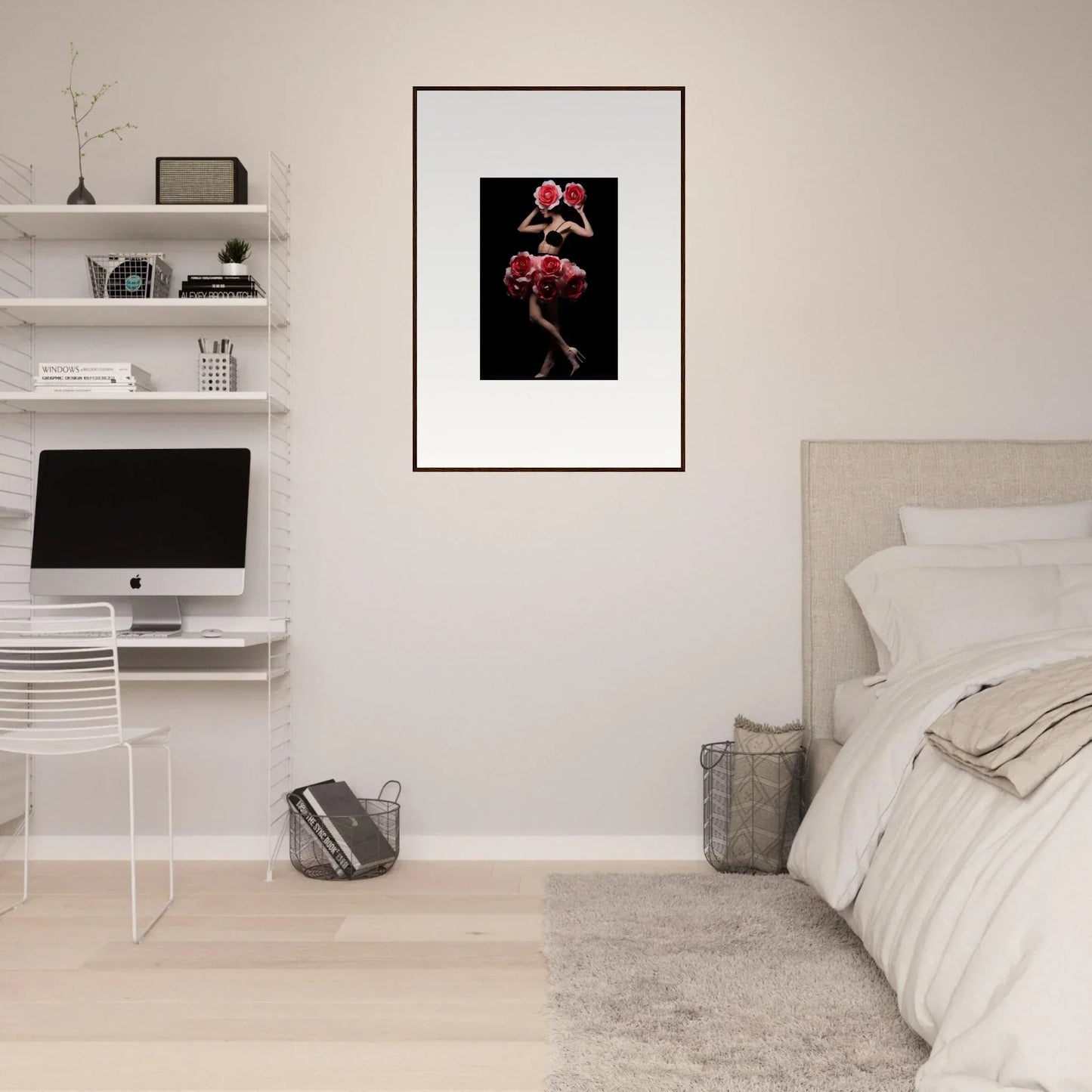 Framed artwork of red flowers on a dark background.