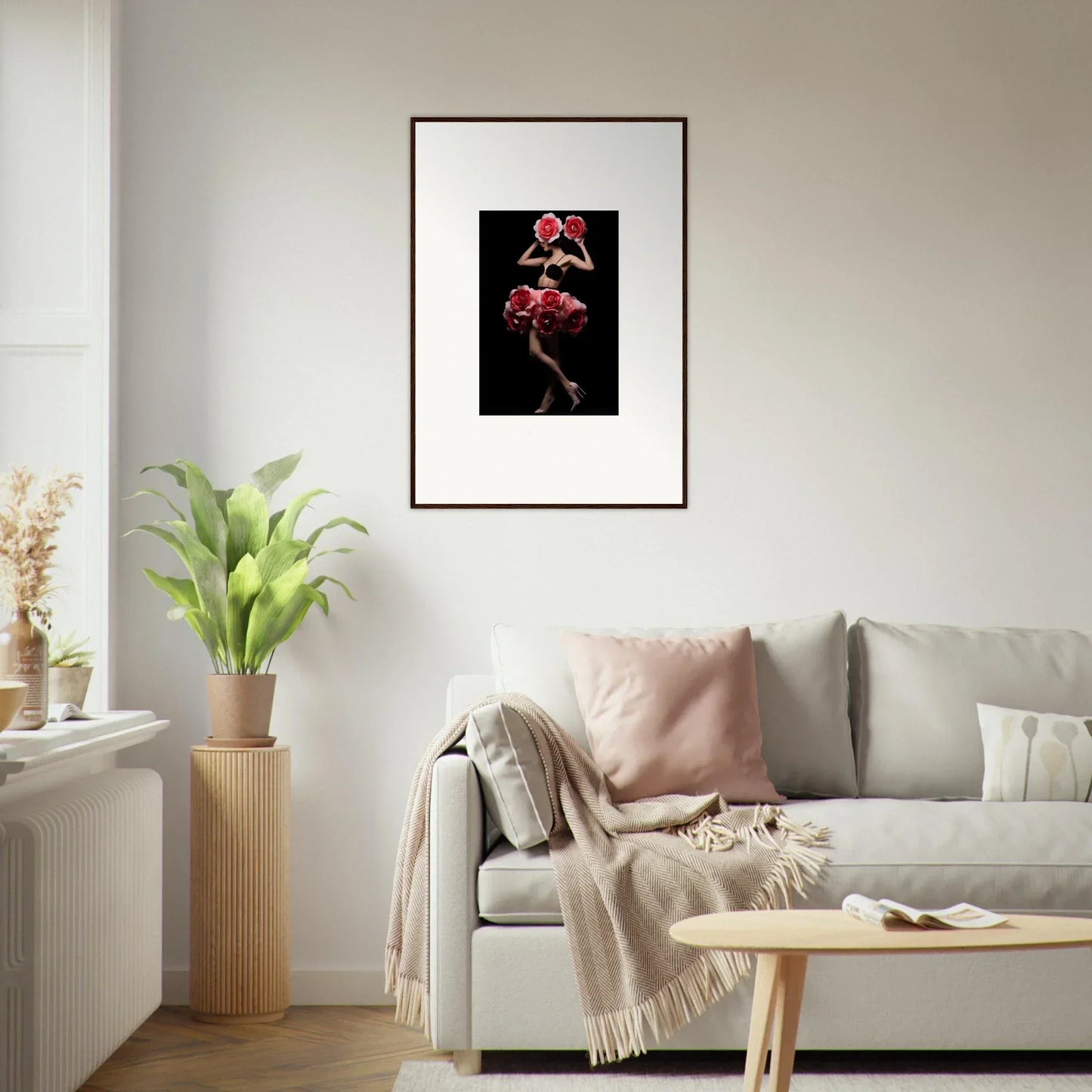 Framed artwork depicting vibrant pink flowers against a dark background.