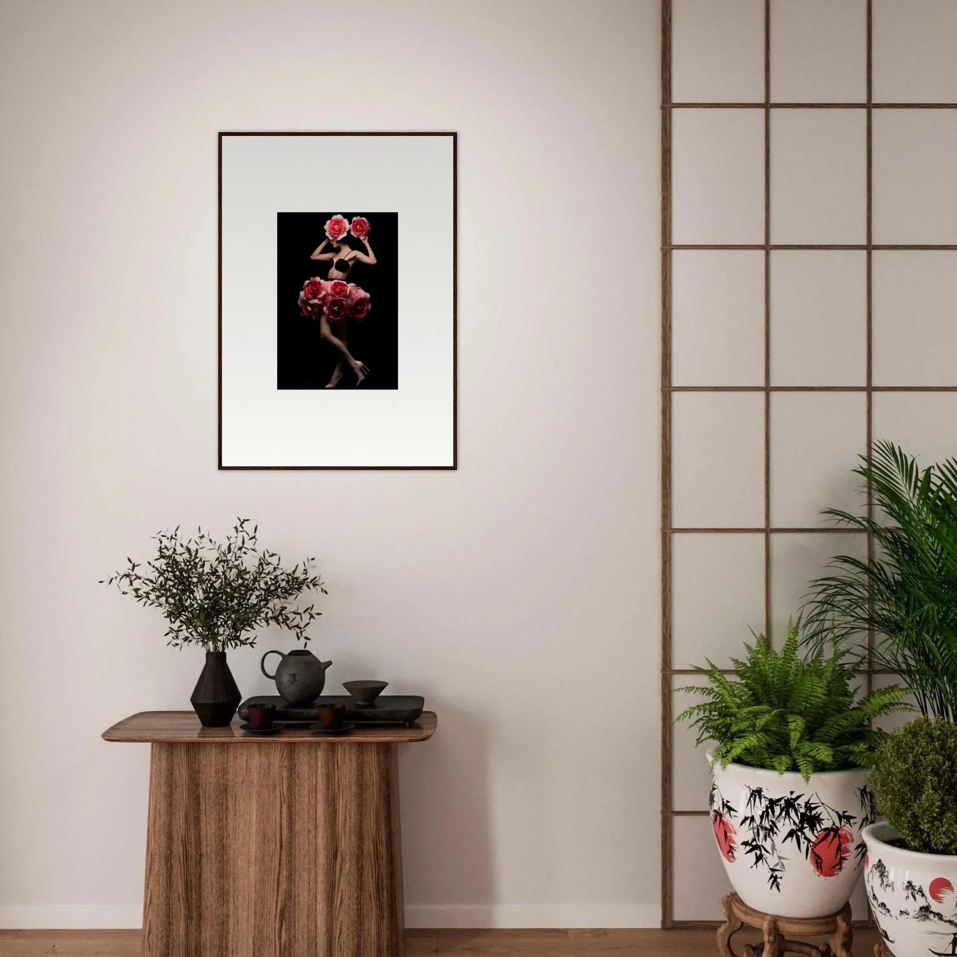 Framed artwork depicting red flowers against a dark background.