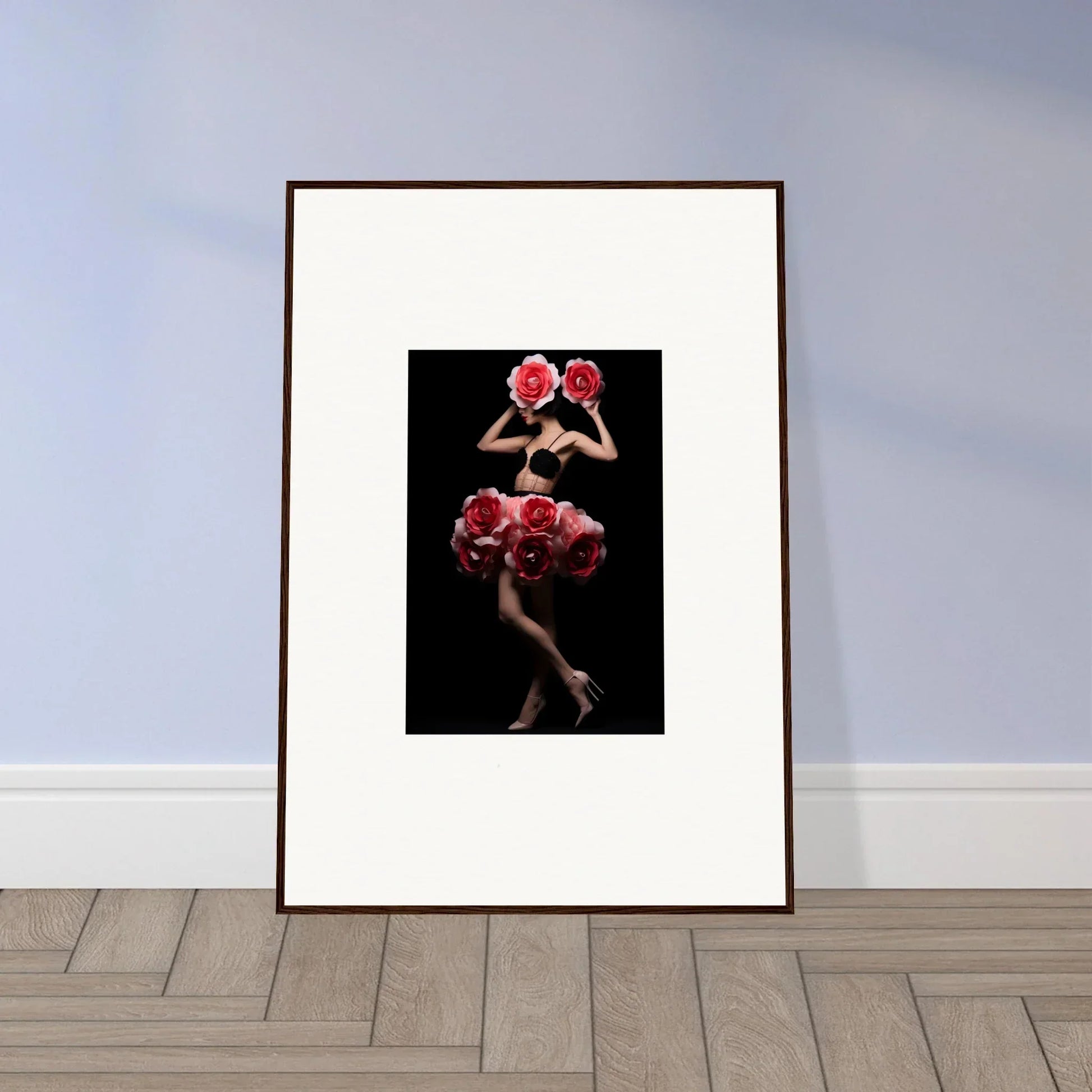 Framed artwork depicting a figure in a red floral dress against a dark background.