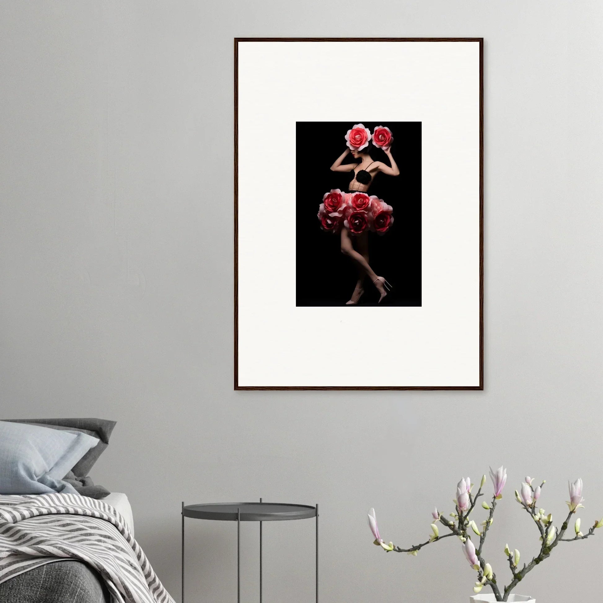 Framed artwork depicting a figure holding red roses against a dark background.