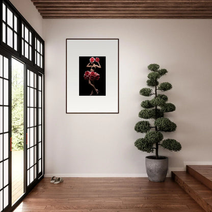 Framed artwork featuring vibrant red flowers against a black background.