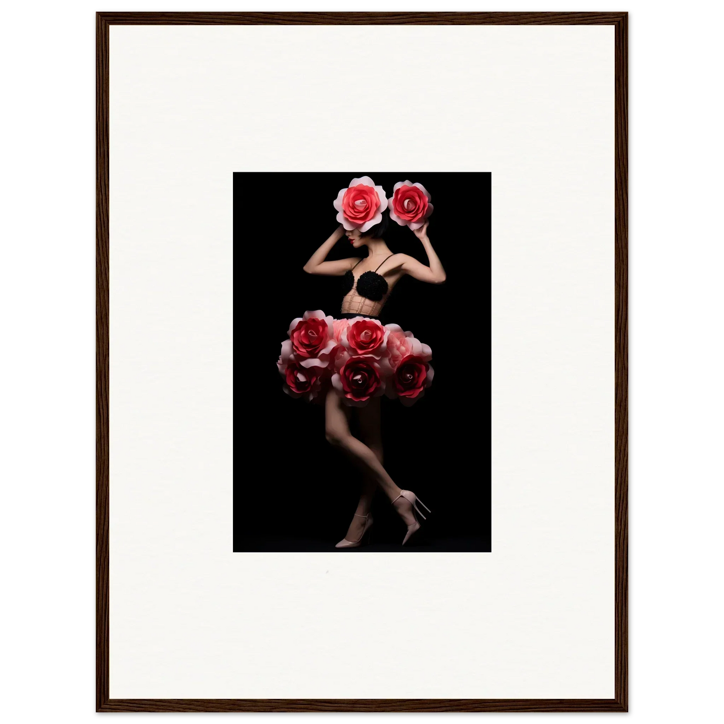 Artistic photograph of a figure adorned with vibrant red roses against a black background.