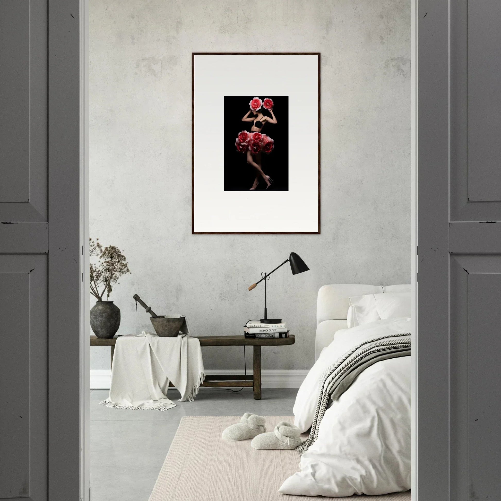 Framed artwork depicting a figure in red against a black background.