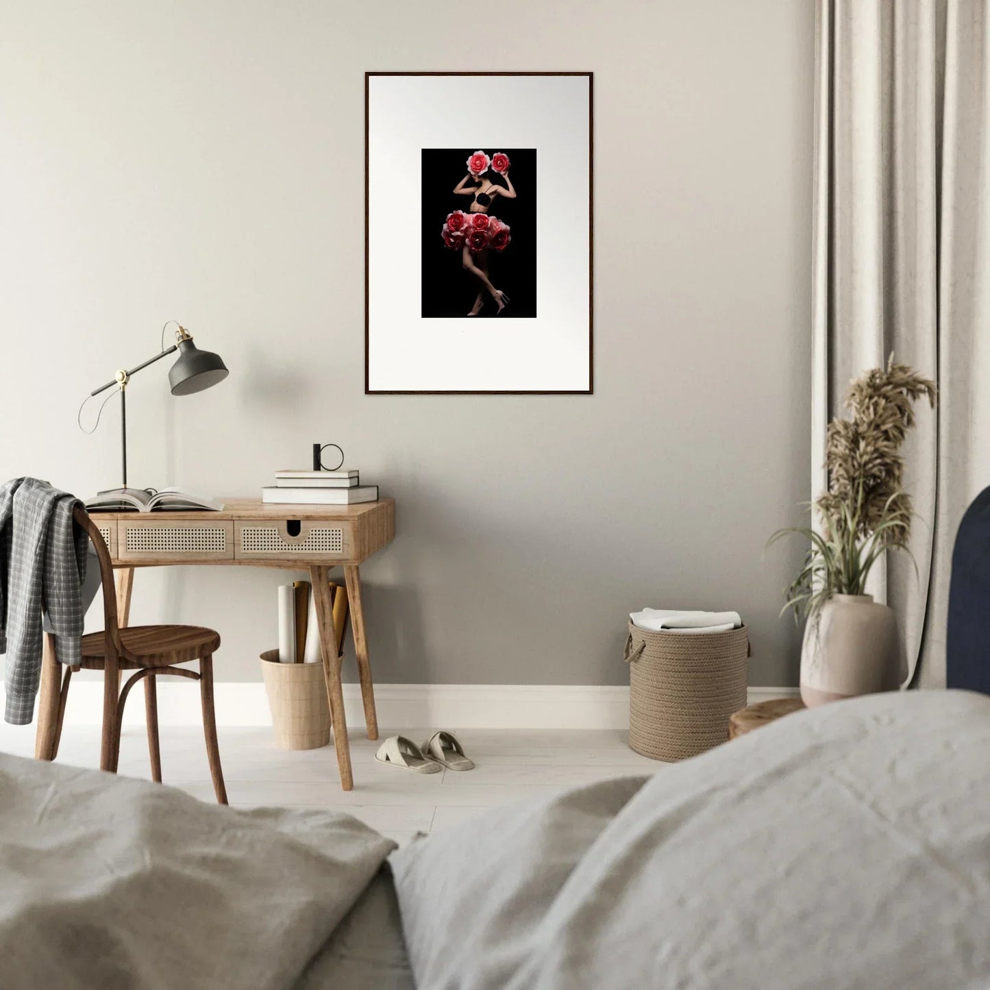 Framed artwork depicting a figure in red against a black background.