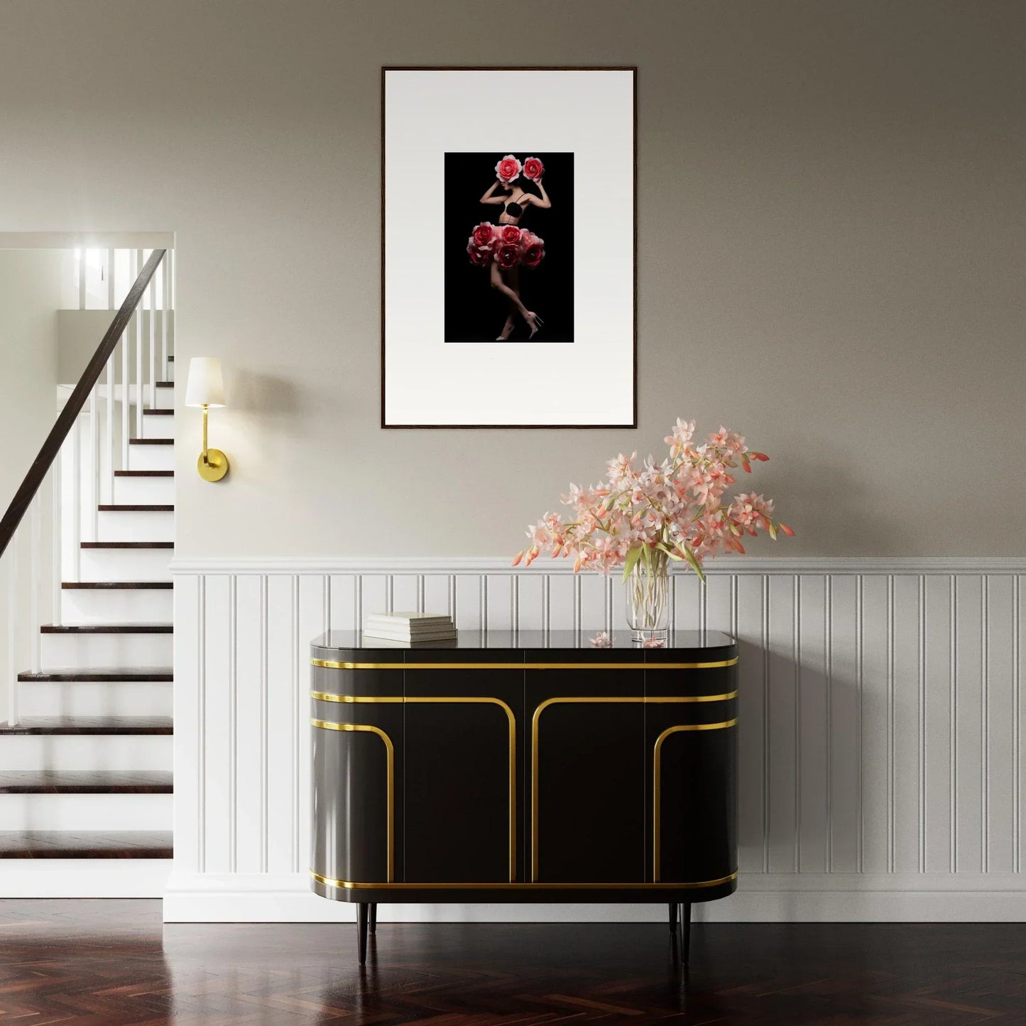 Elegant entryway featuring a black and gold console table with a framed artwork above and floral arrangement on top.