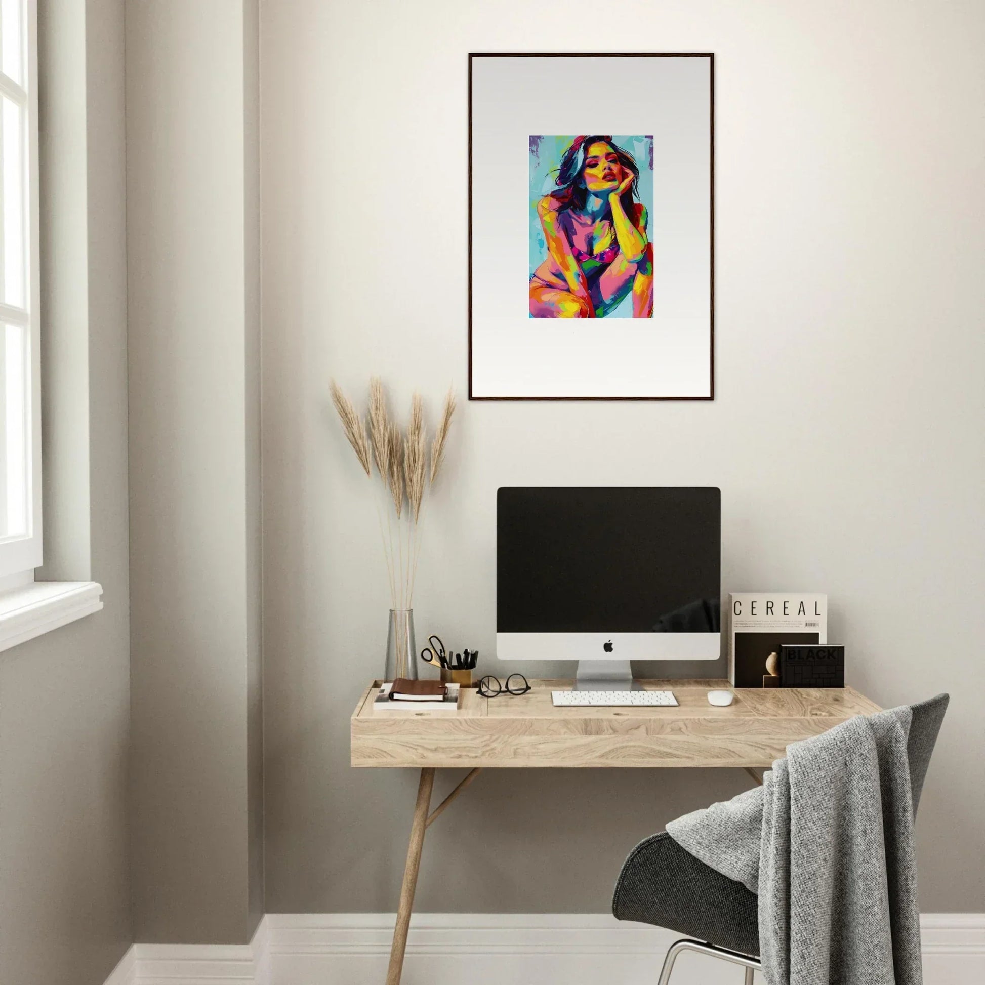 Minimalist home office with wooden desk, computer, and Ecliptic Yearning framed wall art