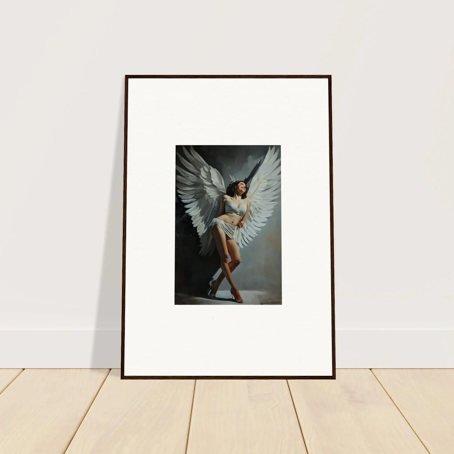 Framed wall art of a figure with large white wings for stunning room decoration