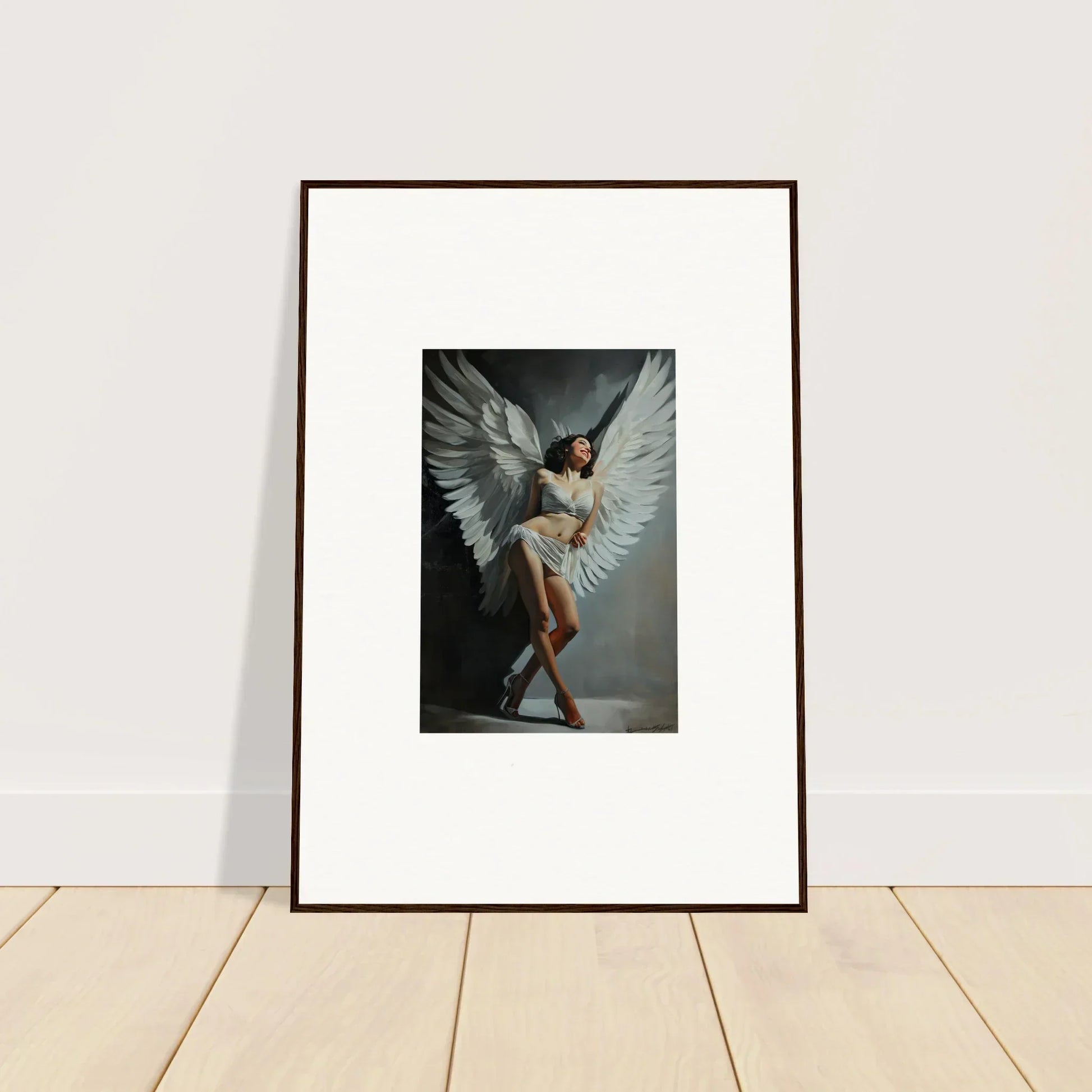 Framed wall art of a figure with large white wings for stunning room decoration