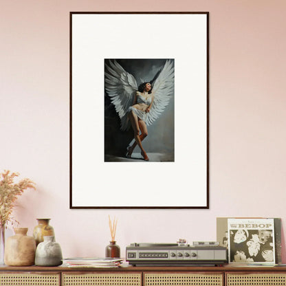 Framed wall art of a figure with white wings in ballet pose for room decoration