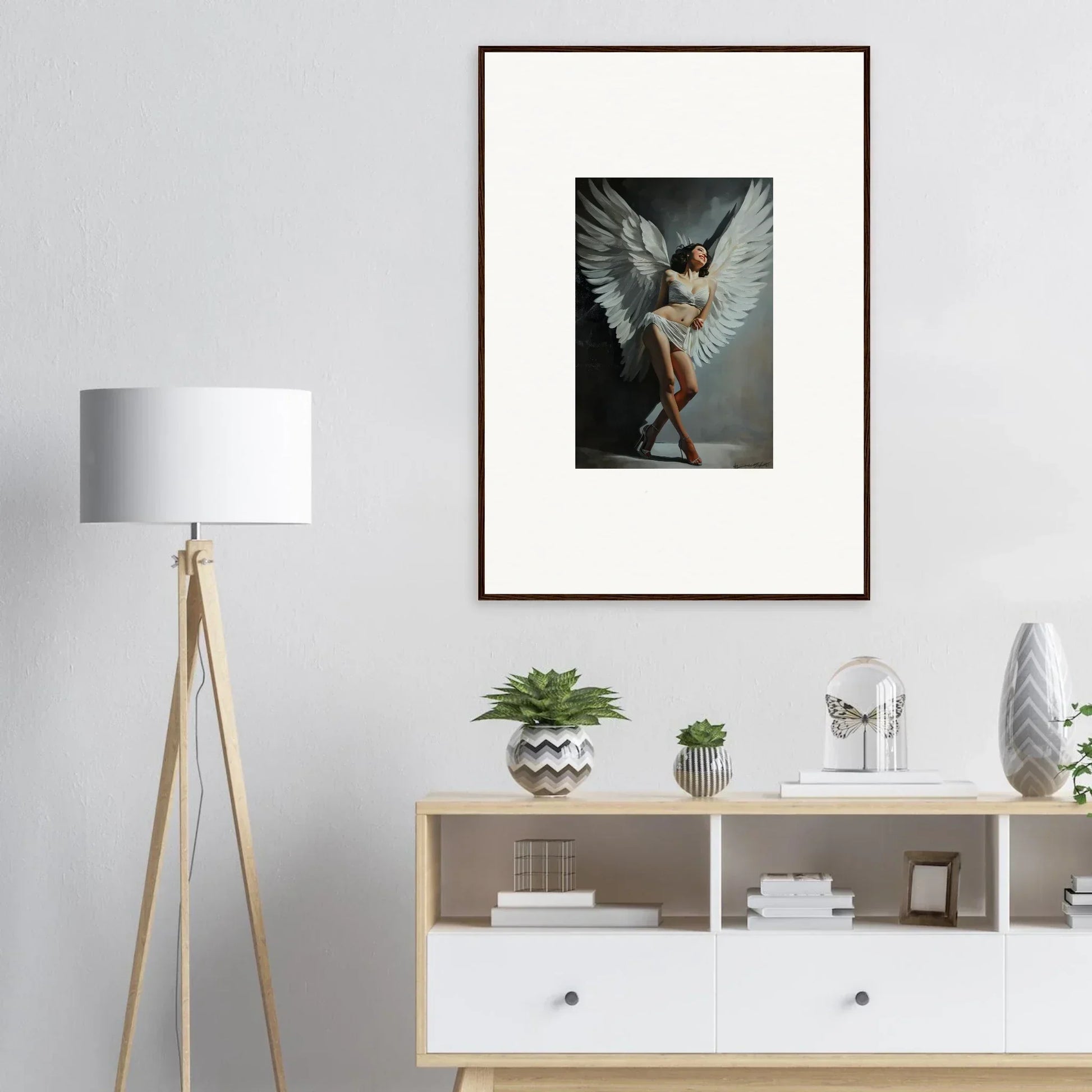 Framed wall art of a dancer with wings, perfect for stylish room decoration