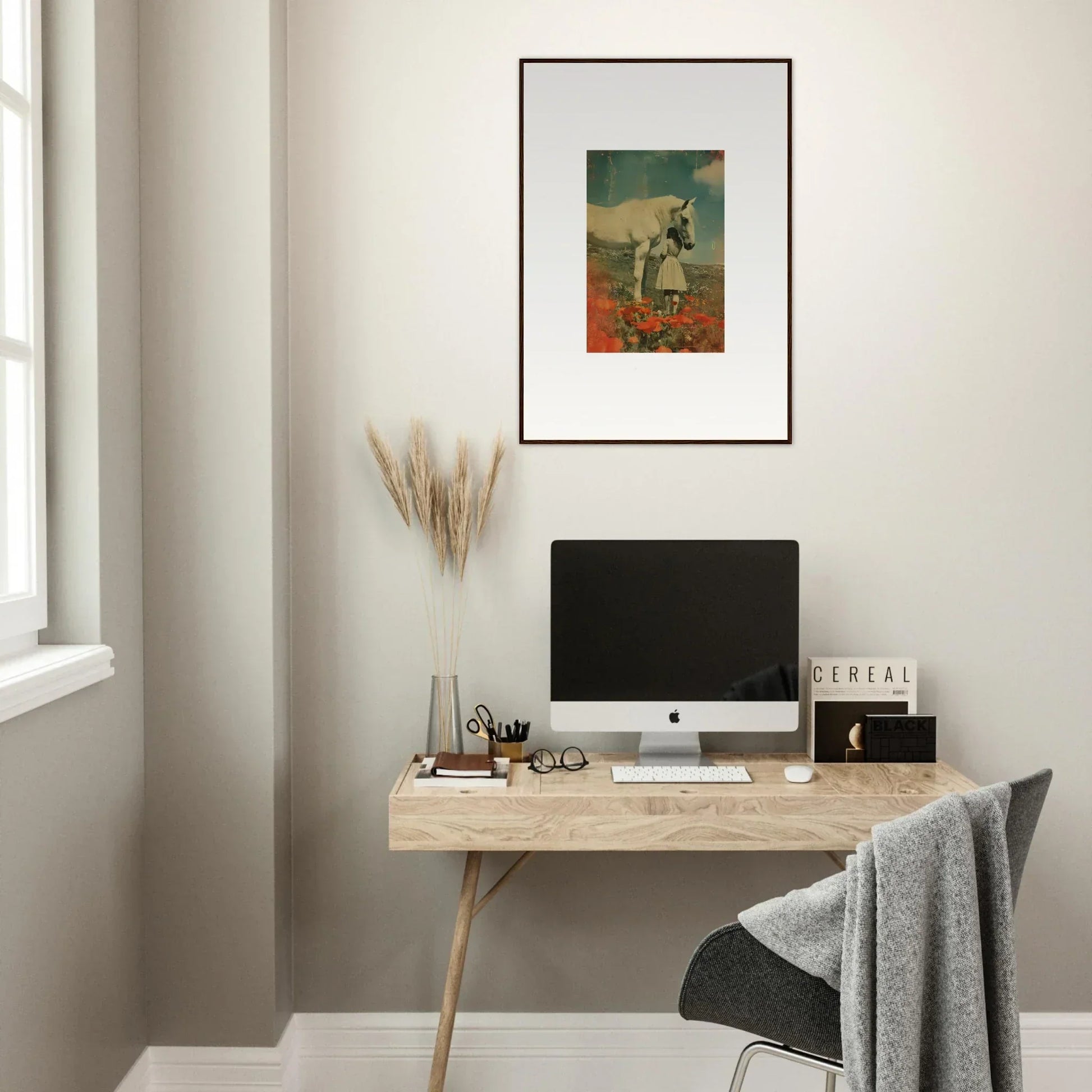 Minimalist home office with wooden desk, computer, and framed wall art in Whisperer Equis