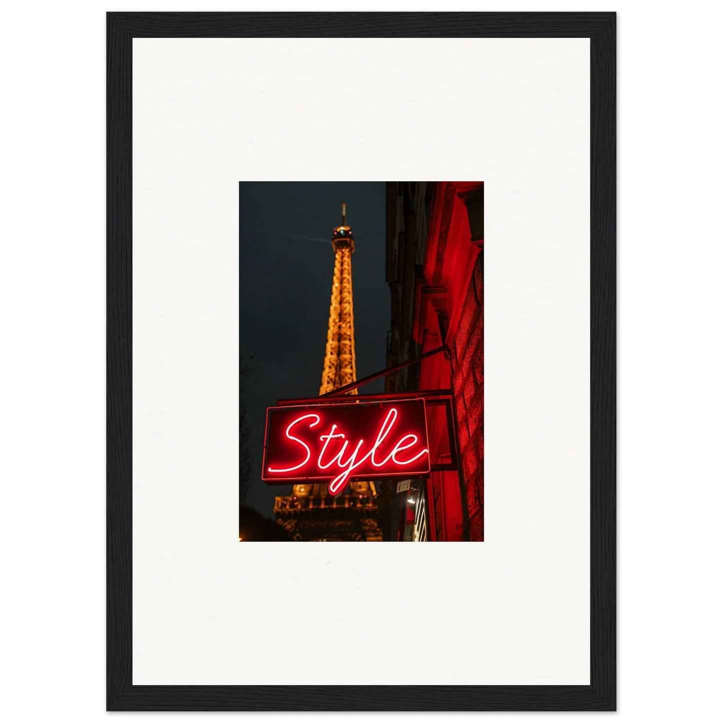 Framed photo of the Eiffel Tower at night, perfect wall art for chic room decoration