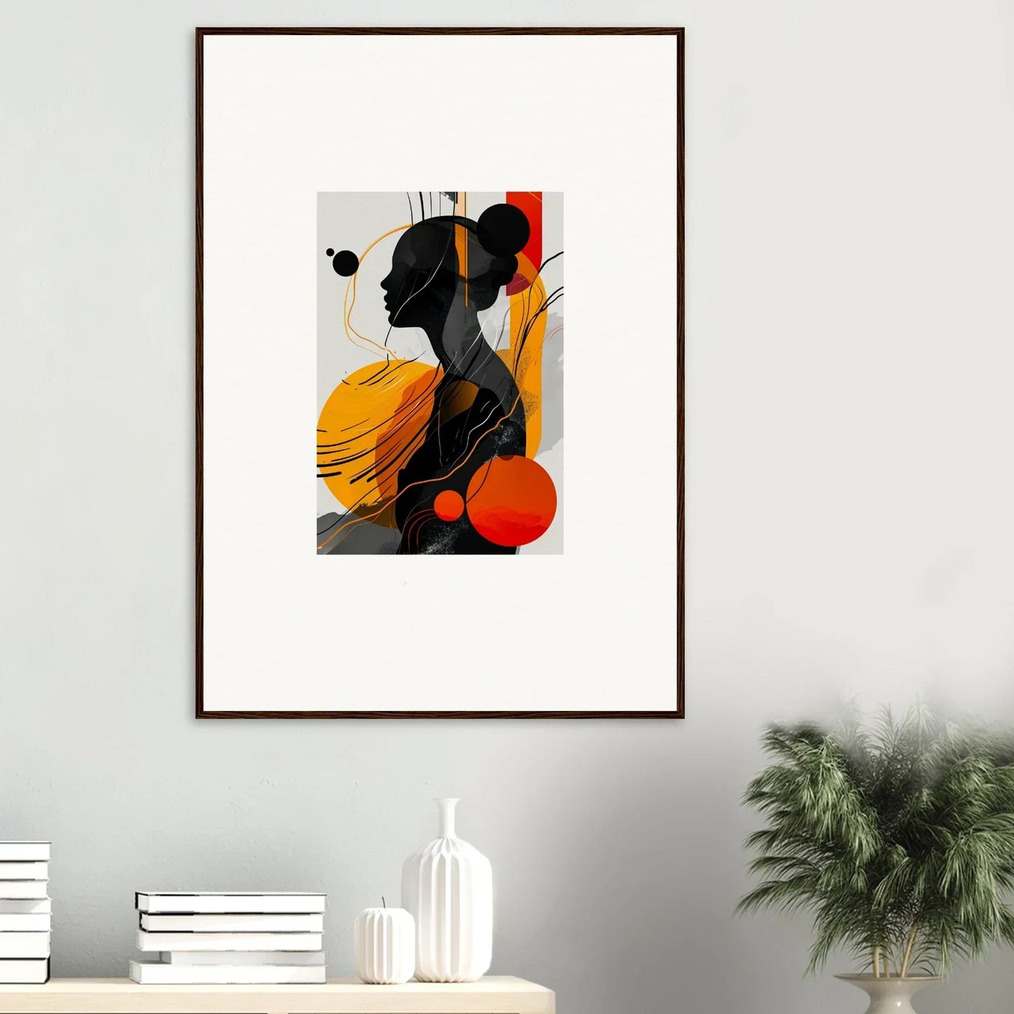 Framed wall art featuring black silhouette on vibrant yellow and red shapes for room decor