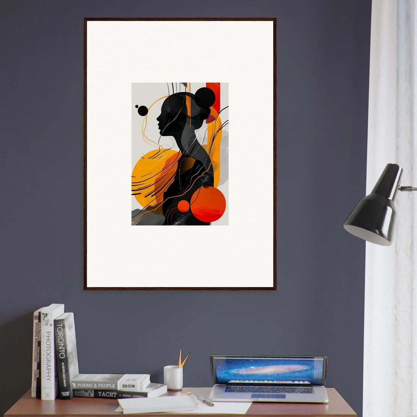 Framed wall art of colorful geometric shapes and a black silhouette for modern room decor