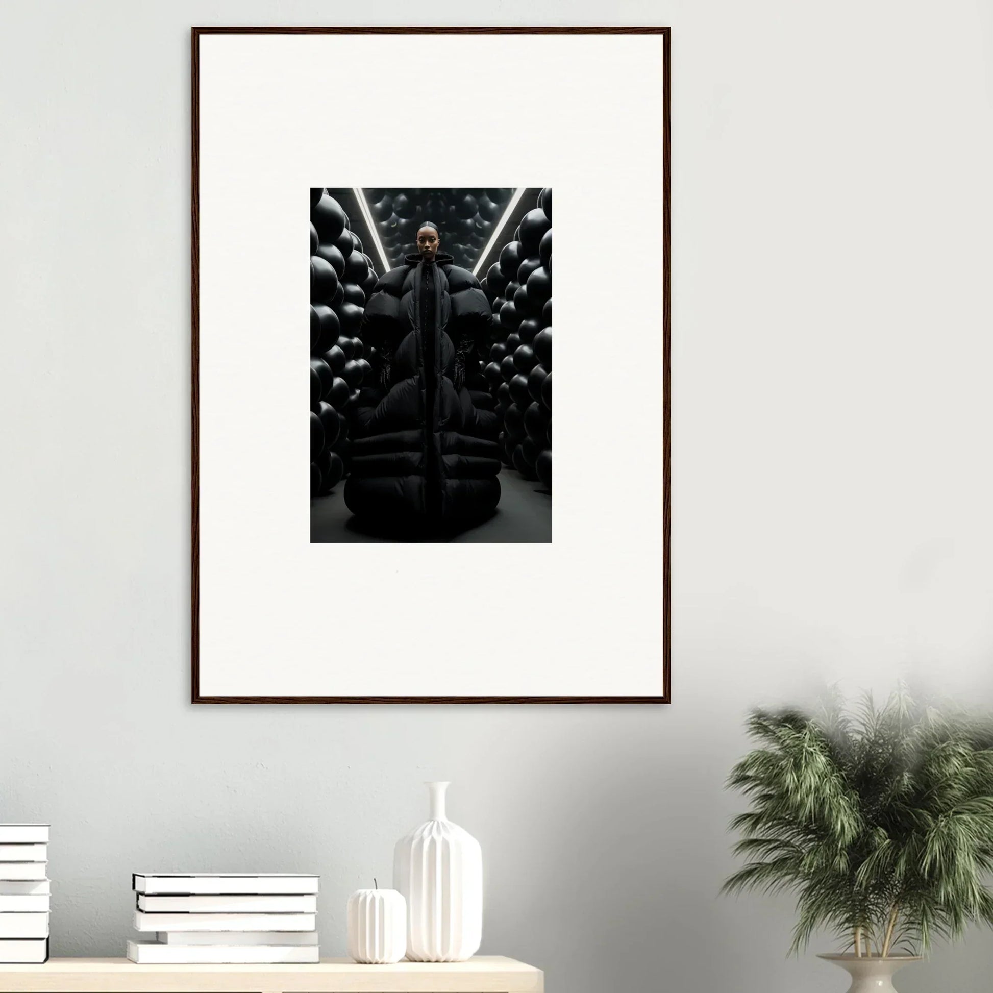 Framed black-and-white photo of a figure with skulls, perfect for lunar echoes decor