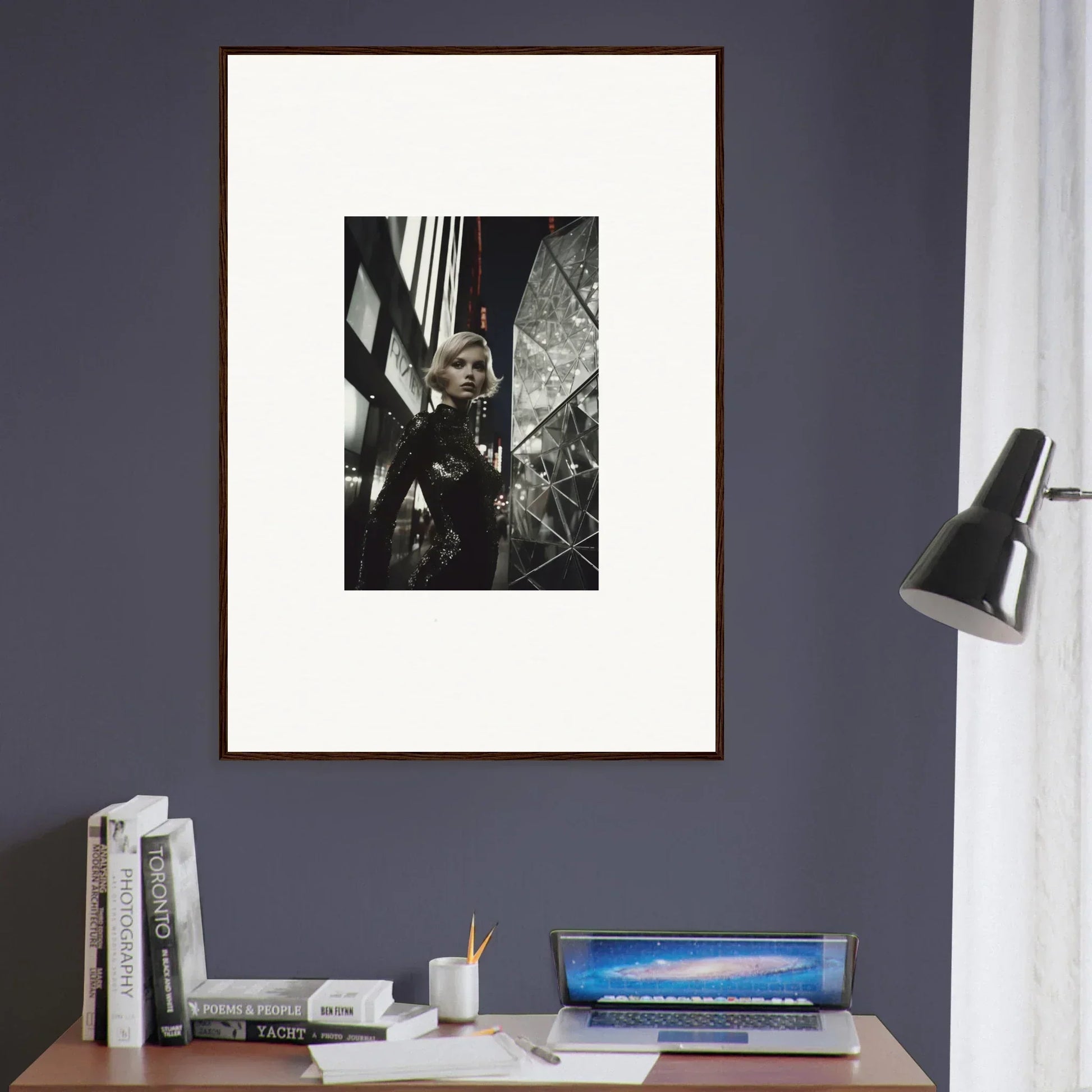 Framed black and white photograph as stylish room decor on a dark wall