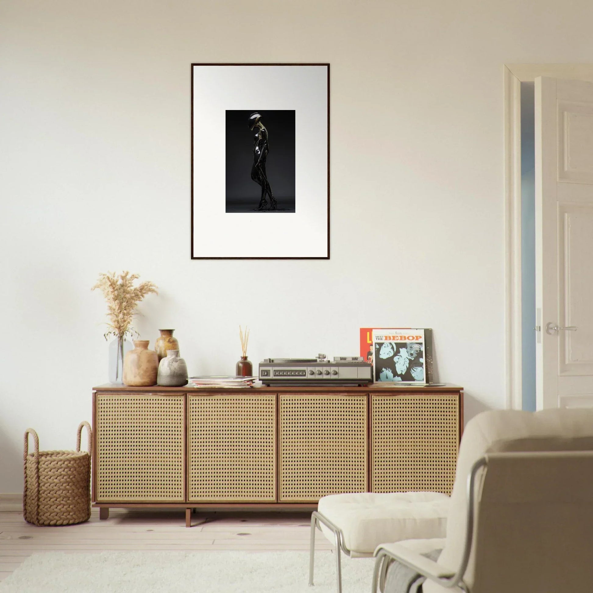 Wooden sideboard with cane-webbed doors, perfect for elegant room decor and framed wall art