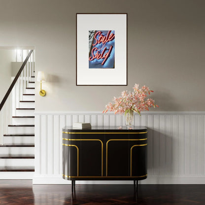 Stylish black and gold sideboard under a colorful canvas print for neon dive room decoration