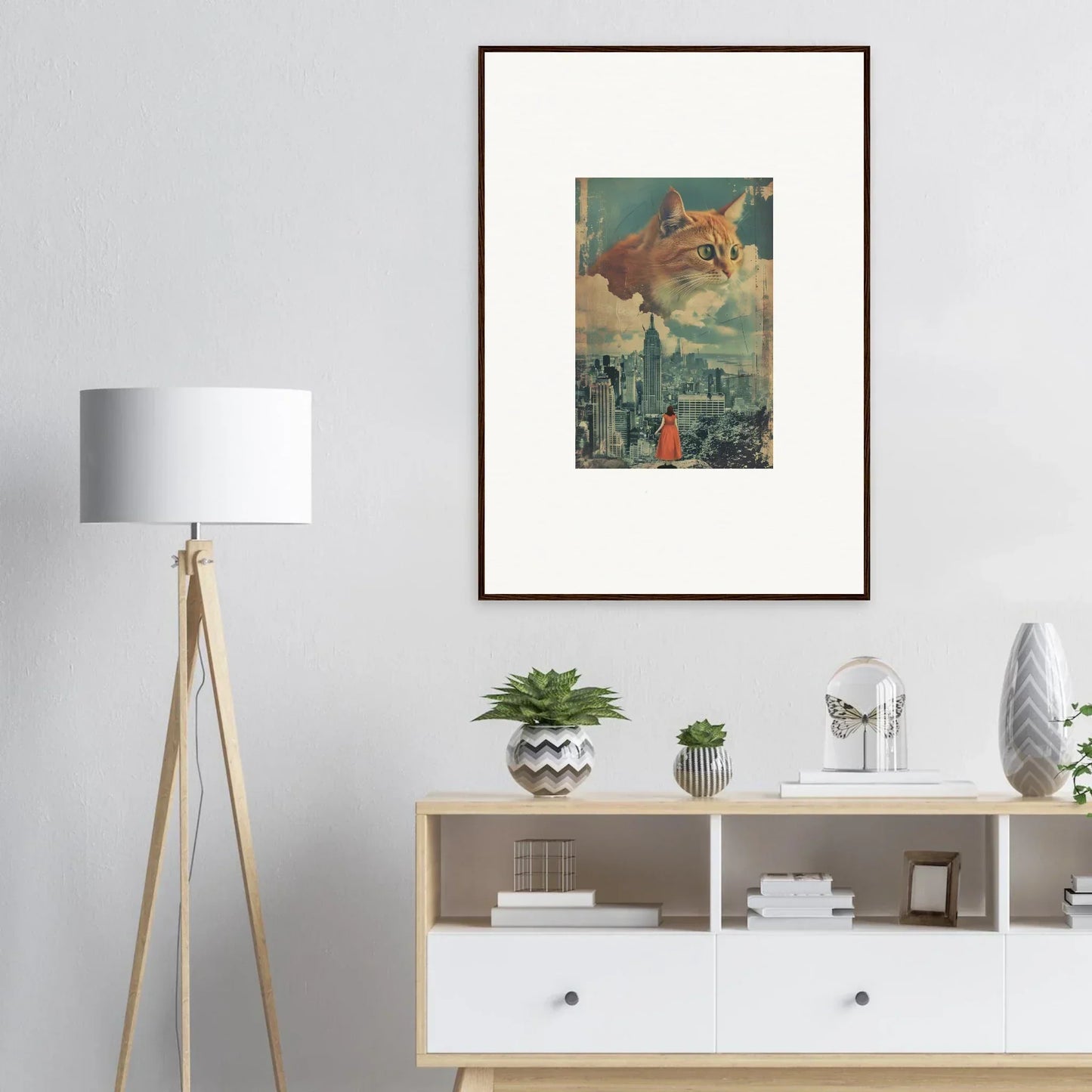 Framed wall art of a giant cat looming over a cityscape for unique room decor