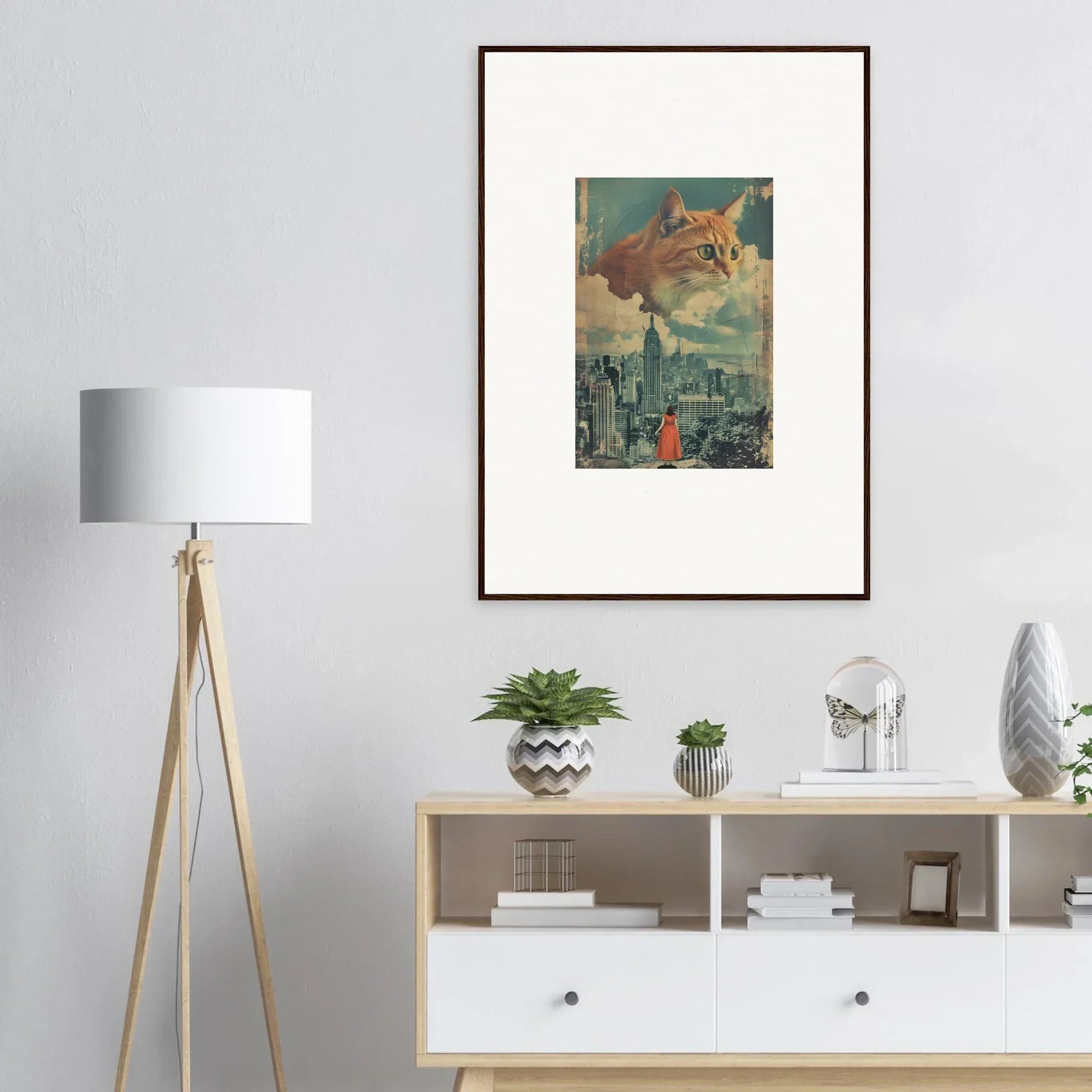 Framed wall art of a giant cat looming over a cityscape for unique room decor