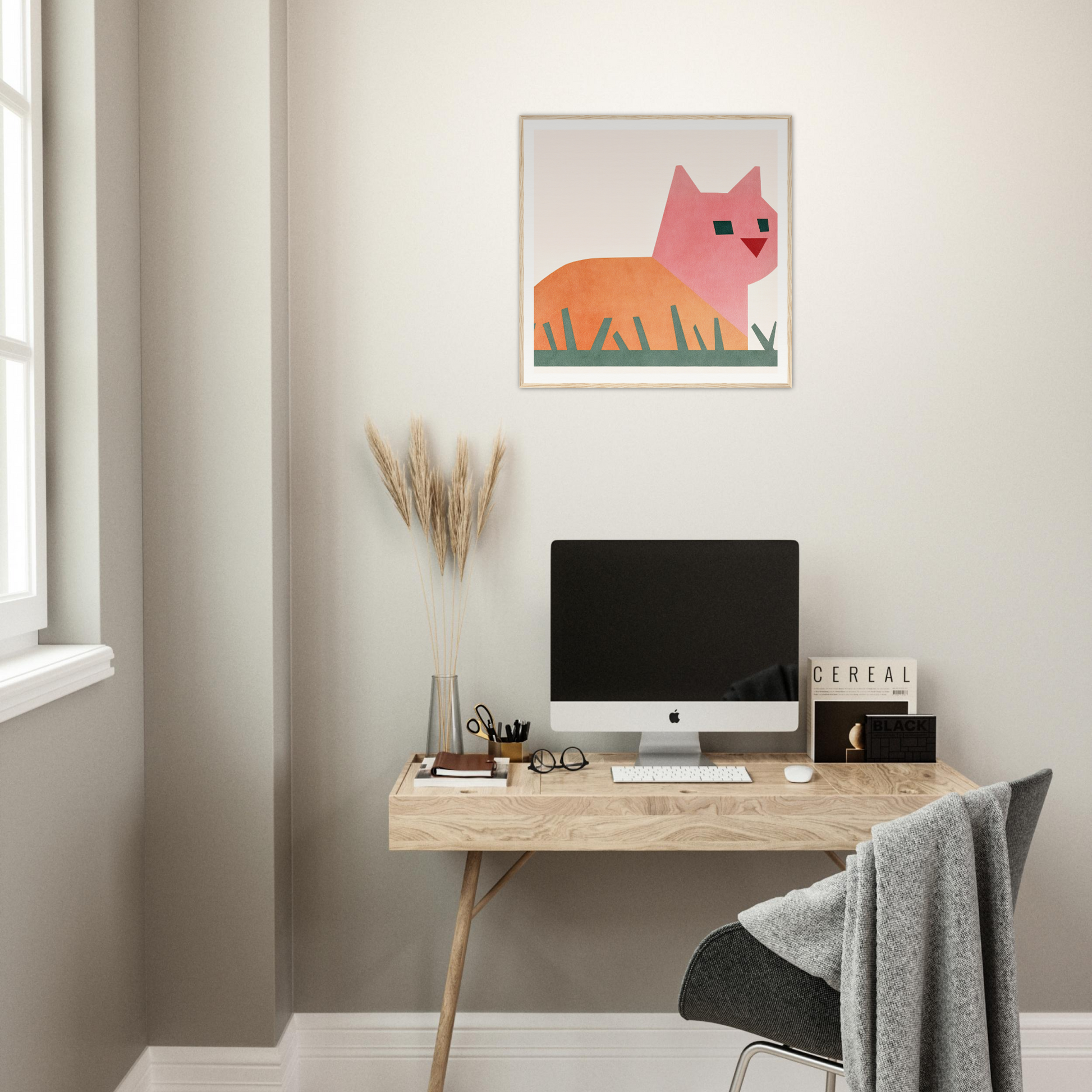 Simple wooden desk featuring an iMac and minimalist decor with Cosmic Curled Cat