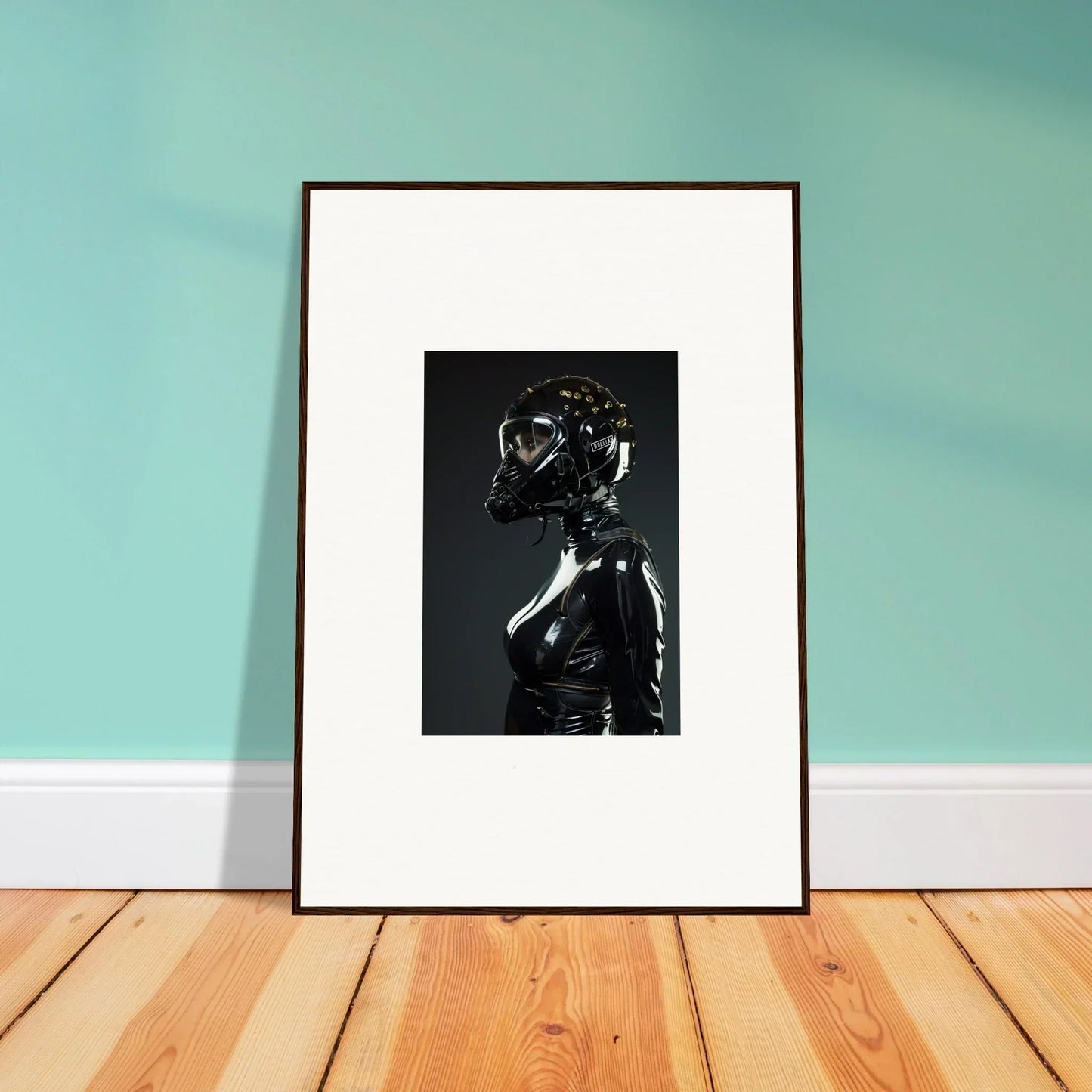 Framed black and white photograph of a figure in a shiny helmet and dark outfit.