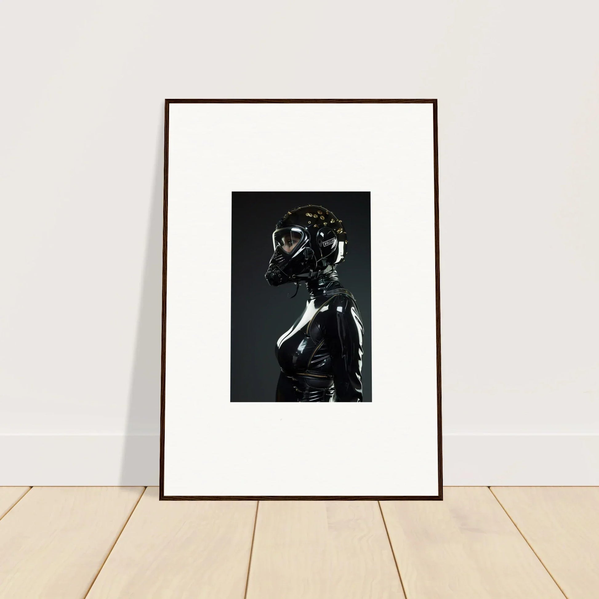 Framed photograph of a figure in a shiny black outfit with a reflective helmet.