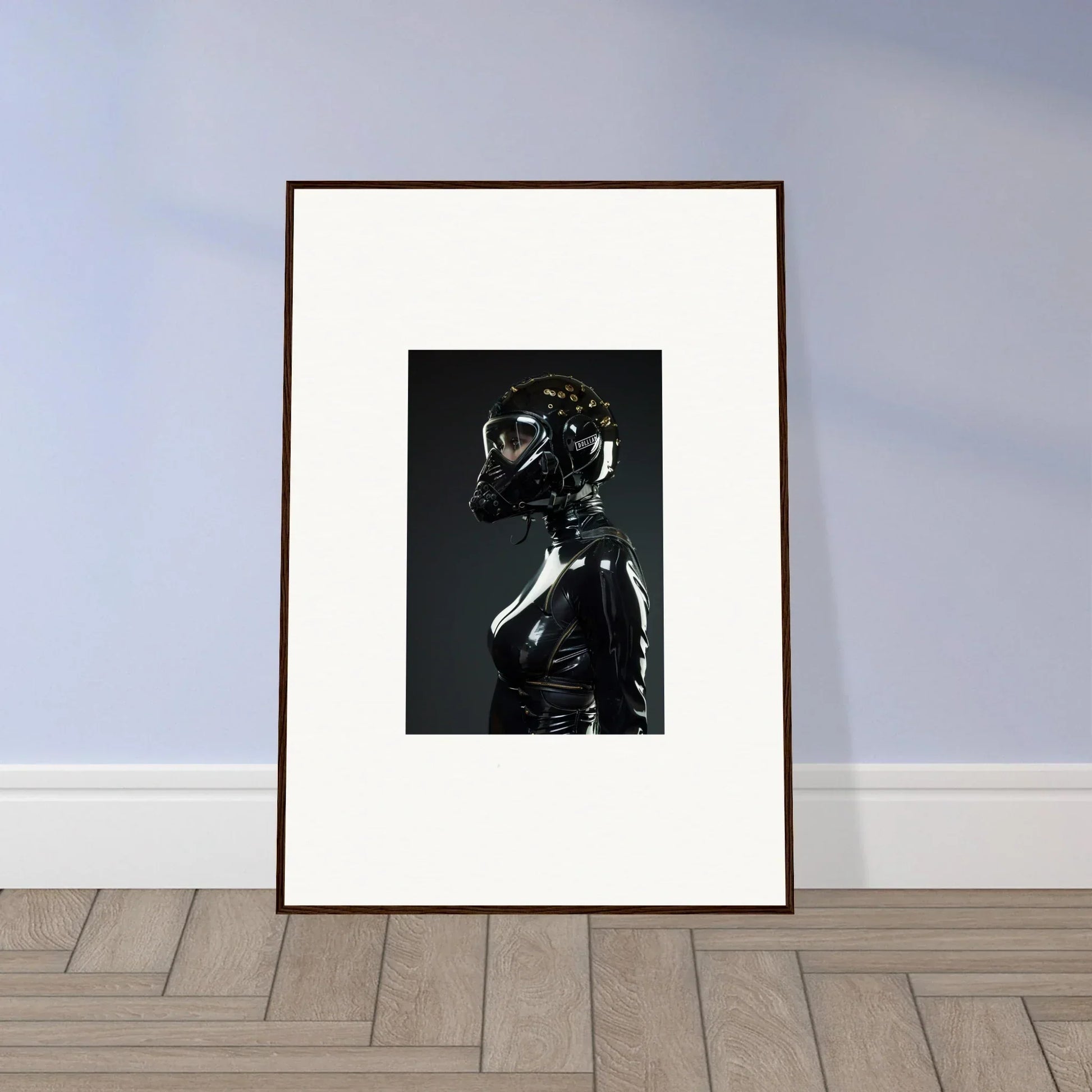 Framed black and white photograph of a figure in shiny, form-fitting attire with a reflective helmet.