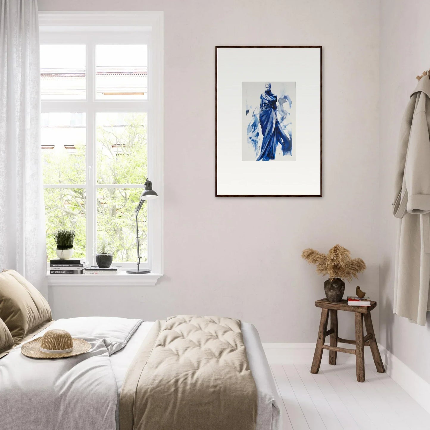 Minimalist bedroom with Cosmic Mood Cloaked and soft beige bedding, plus blue framed wall art