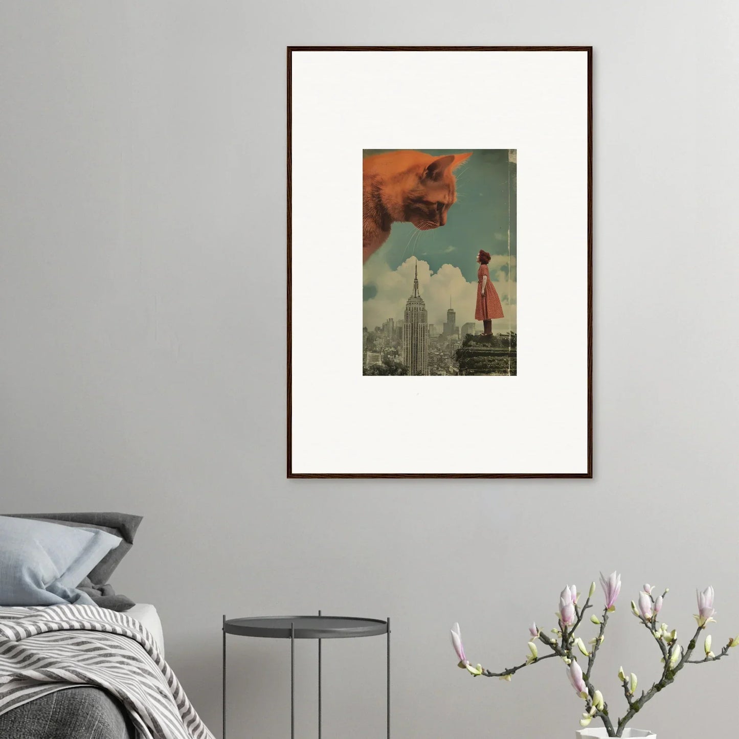 Framed surrealist wall art of a giant cat head and cityscape for whimsical room decor