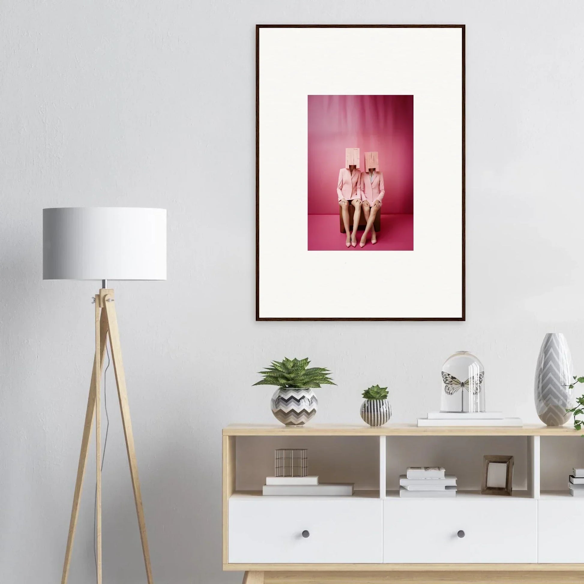 Framed wall art of nude figures on pink background for unique room decoration