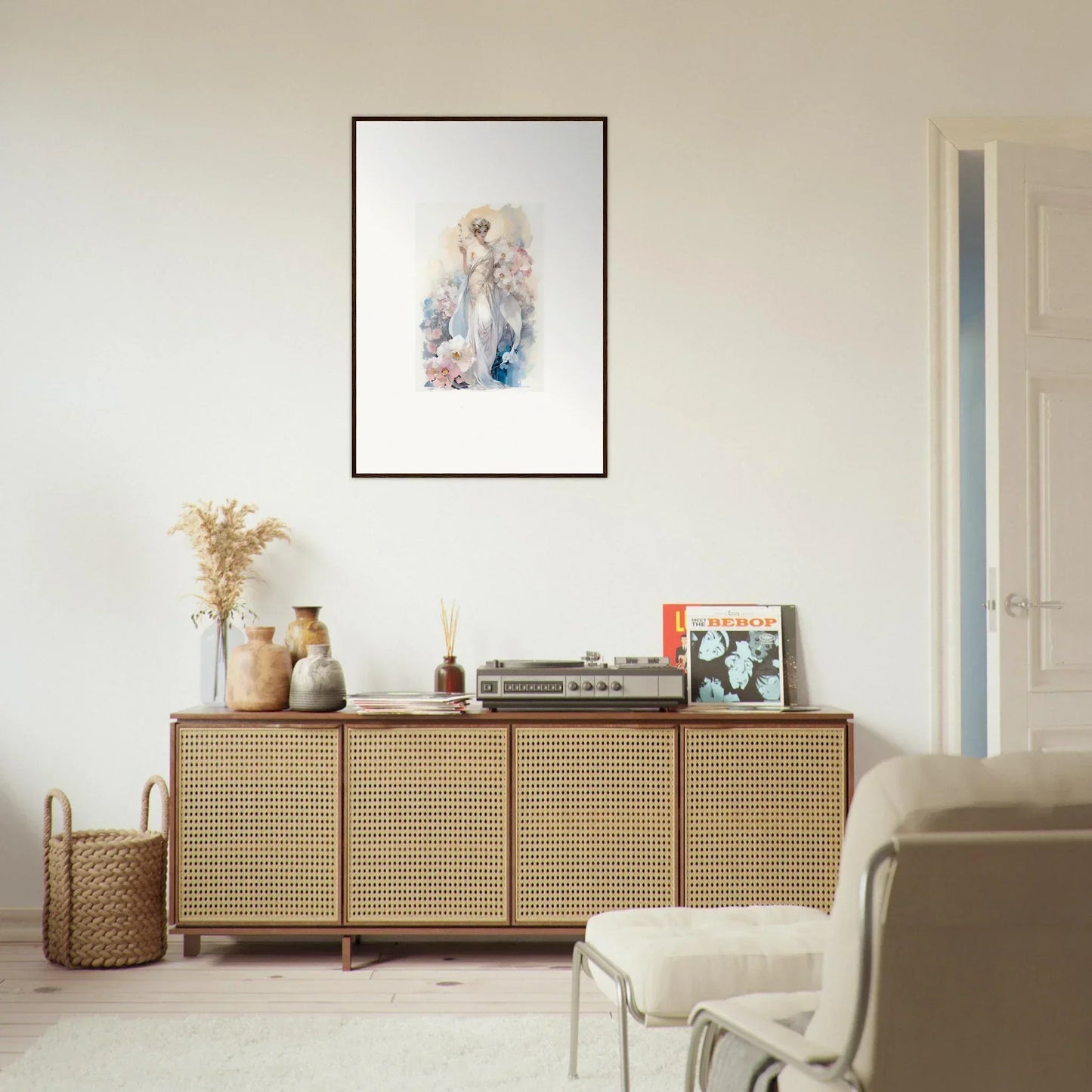 Wooden sideboard with cane-webbed doors for room decor amidst bloom and framed wall art